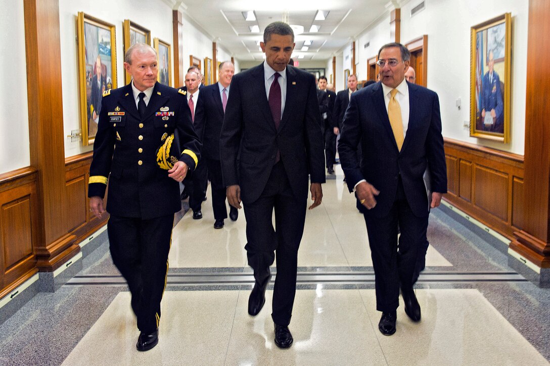 President Barack Obama walks with Defense Secretary Leon E. Panetta and Army Gen. Martin E. Dempsey, chairman of the Joint Chiefs of Staff, to a press briefing at the Pentagon, Jan. 5, 2012. Obama and Panetta delivered remarks on a defense strategy for the Defense Department going forward. Deputy Defense Secretary Ashton B. Carter, members of the Joint Chiefs and service secretaries joined them. 
