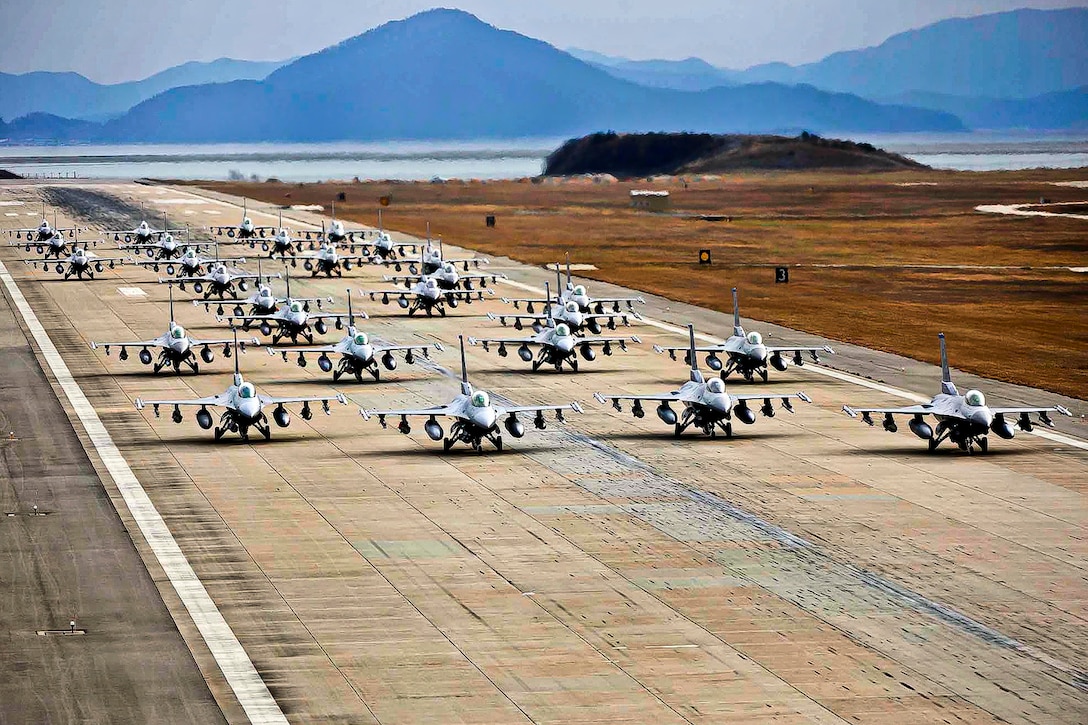 F-16 Fighting Falcons demonstrate an "elephant walk " formation as they taxi down a runway during an exercise on Kunsan Air Base, South Korea, Dec. 2, 2011. The Falcons are assigned to the 8th and 419th Fighter Wings. The exercise showcased the participating aircrews' ability to quickly and safely prepare an aircraft for a wartime mission.  
