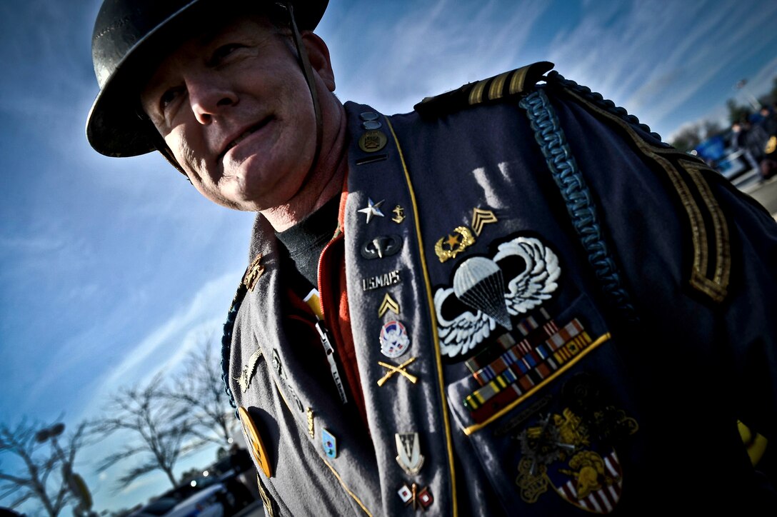 An Army football fan wears an outfit covered with Army medals and unit patches outside FedEx Field in Landover, Md., Dec. 10, 2011. 

