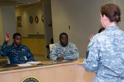 OFFUTT AIR FORCE BASE, Neb. (June 5, 2014) Yeoman 1st Class Jerron Williams responds to a question during the first U.S. Strategic Command (USSTRATCOM) Rising Strategic Leaders (RSL) group meeting. The RSL group promotes communication, professionalism, responsibility, camaraderie, esprit de corps and mentoring of the mid-to- lower enlisted corps across all services within USSTRATCOM through professional development, information flow, community service, and morale-building activities. (U.S. Navy photo by Mass Communication Specialist 1st Class Byron C. Linder/Released)