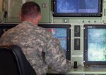 Spc. Craig Craun, an unmanned aerial vehicle operator with B Company, 76th Infantry Brigade Combat Team observes UAV flight operations during Bold Quest 12-1, June 13, at Camp Atterbury Joint Maneuver Training Center, Ind. Bold Quest 12-1 is a two-week air combat assessment exercise that focuses on testing digital communication technologies to reduce friendly fire incidents, enhance combat effectiveness, and increase situational awareness on the battlefield.