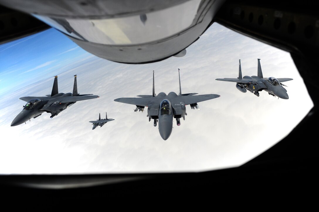 Aircrew members assigned to the 4th Fighter Wing accompany Col. Jeannie Leavitt (middle) on her final flight, May 29, 2014, over North Carolina. Leavitt will depart Seymour Johnson Air Force Base, N.C., for an assignment to the Pentagon as the principle military assistant to the Secretary of Defense. Leavitt is the 4th FW commander. (U.S. Air Force photo/Senior Airman John Nieves Camacho)