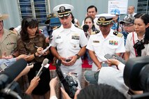 , Vietnam (June 6, 2014) - U.S. Navy Capt. Brian Shipman, Pacific Partnership mission commander, answers questions at a press conference on the pier aside JS Kunisaki.  Pacific Partnership is in its ninth iteration and is the largest annual multilateral humanitarian assistance and disaster relief preparedness mission conducted in the Asia-Pacific region. (U.S. Navy photo by Chief Mass Communication Specialist Greg Badger/Released)
