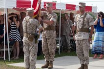 Col. Terrence A. O’Connell (left) receives the regimental colors for Combat Logistics Regiment 25, 2nd Marine Logistics Group during a change of command ceremony at Camp Lejeune, N.C., June 4, 2014. Col. Kevin J. Stewart, the regiment’s new commanding officer, later received the regimental colors from Col. Terrence A. O’Connell, who took command of CLR-25 in 2012. (U.S. Marine Corps still image by Cpl. Jessica S. Gonzalez)