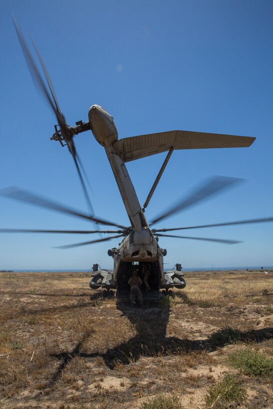 A CH-53E Super Stallion with Marine Heavy Helicopter Squadron (HMH) 465 prepares to take off with reconnaissance Marines from Marine Corps Base Camp Pendleton, Calif., for parachute-operation training aboard MCB Camp Pendleton, June 3. The training was part of a collaborative exercise between HMH-465 and reconnaissance Marines, which also included a troop-lifting exercise. 