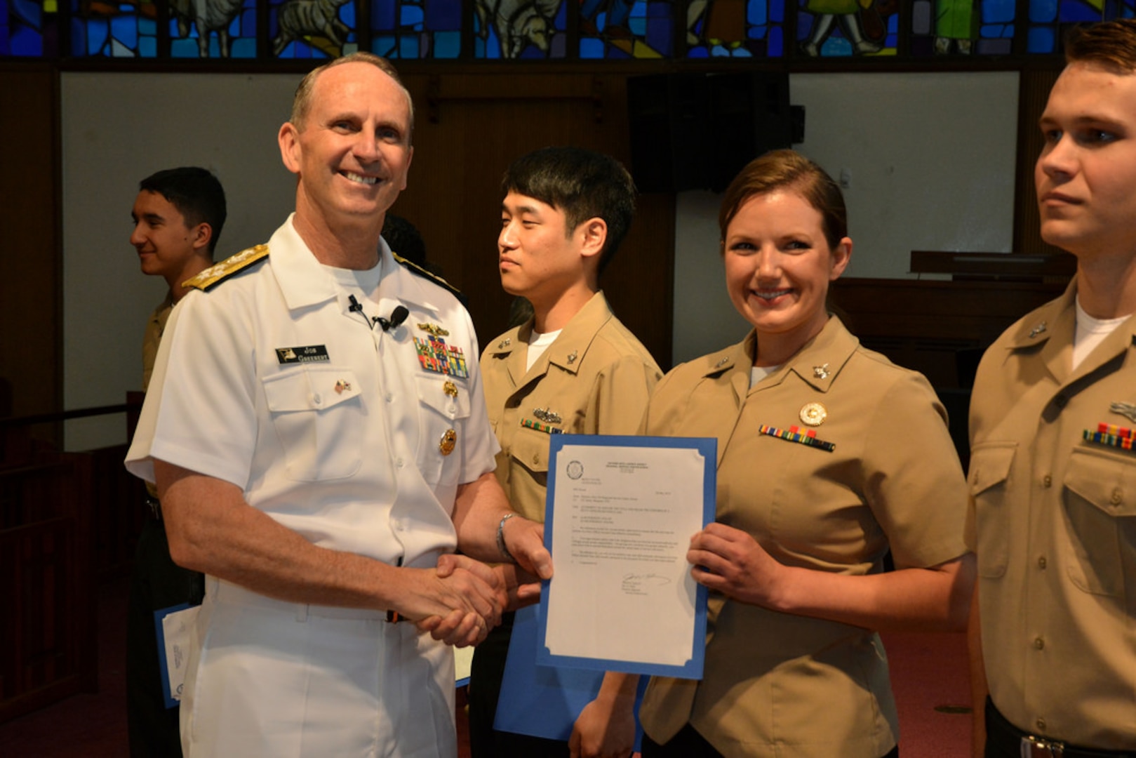 Chief of Naval Operations Adm. Jonathan Greenert frocks Information Systems Technician 2nd Class Margaret Steck before an all hands call for Seoul-based sailors and Navy families on U.S. Army Garrison Yongsan, May 30. 