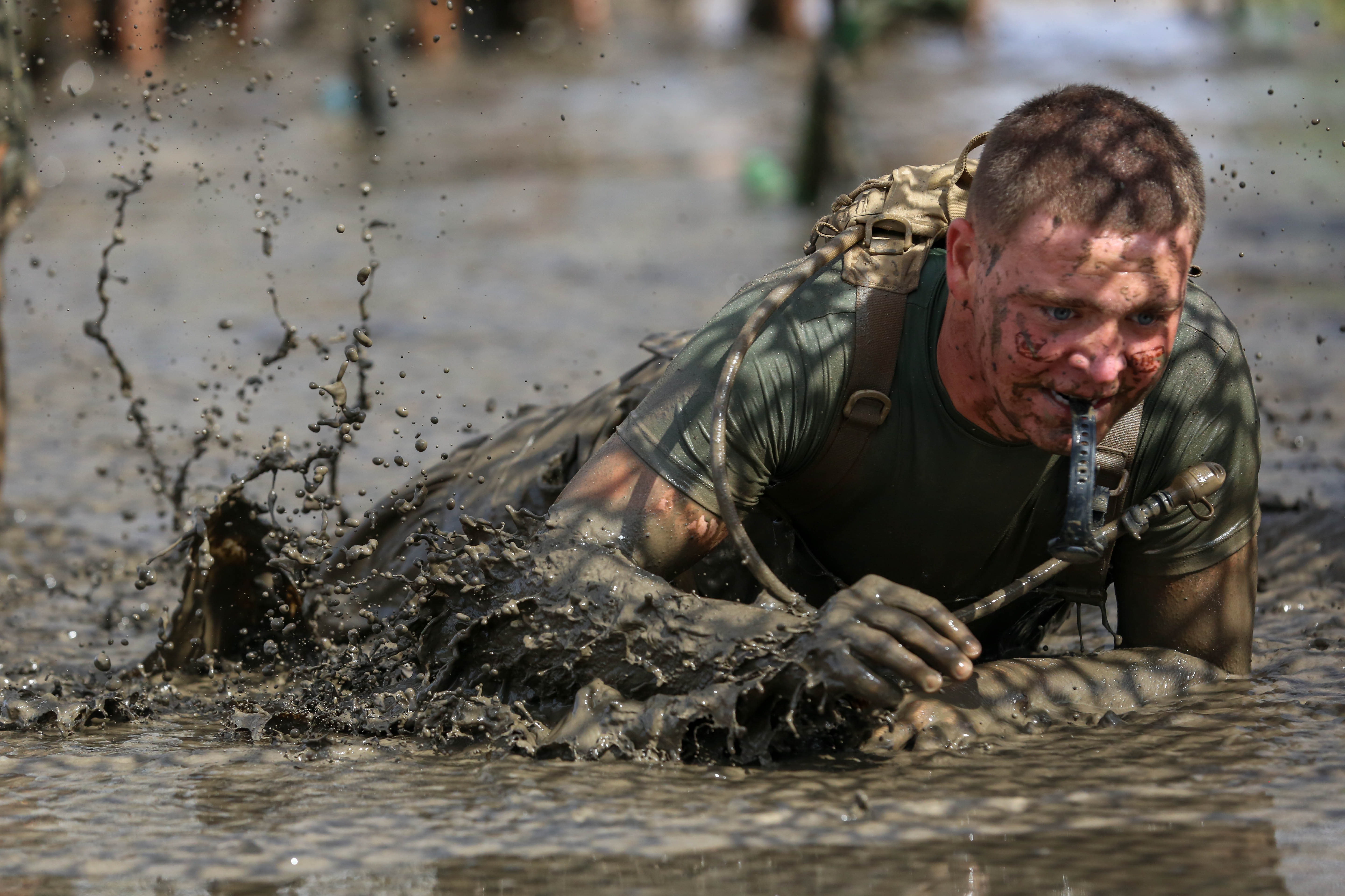 Marines and sailors run the World Famous Mud Run