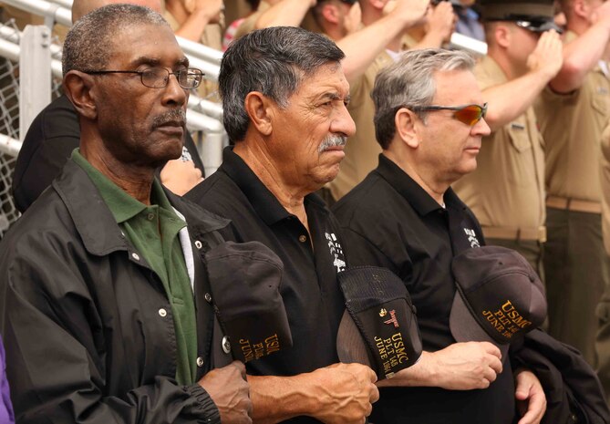 (from left to right) Samuel Keyes, John Sandoval and Phil Uzzo, from the Marine Corps Recruit Depot San Diego Platoon 145 Association, render honors during the National Anthem, June 6, 2014. The sssociation attended the graduation ceremony for Company C Marines as part of their anniversary celebration. (Photo by Marc Ayalin)