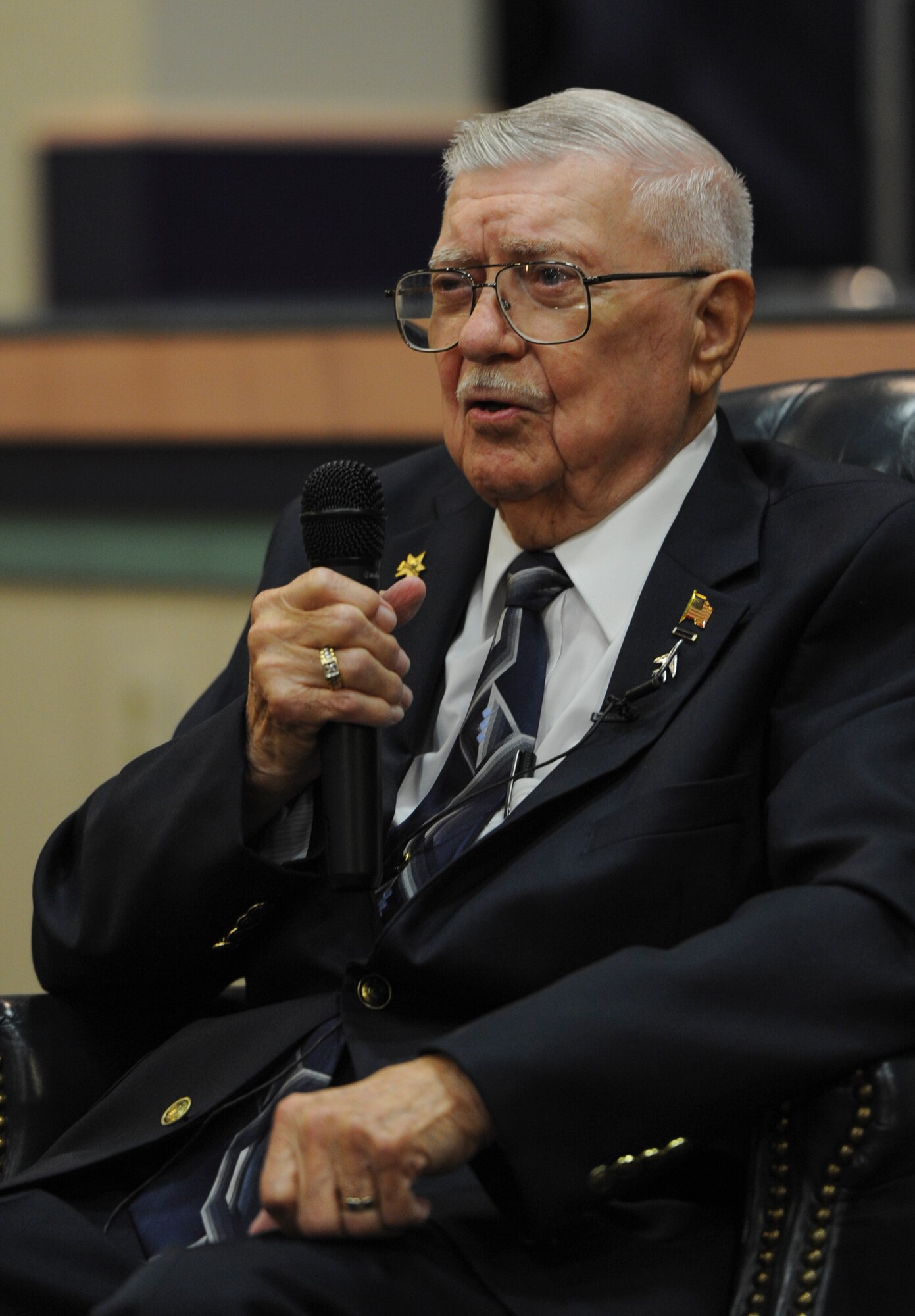 Retired Col Melvin Bryant speaks at a commerative seminar on Hurlburt Field, Fla., June 6, 2014. In 1944, Bryant was sent to fight on the Italian front to fly with the 2nd Fighter Squadron as a P-51 Mustang pilot. (U.S. Air Force photo/Senior Airman Christopher Callaway) 