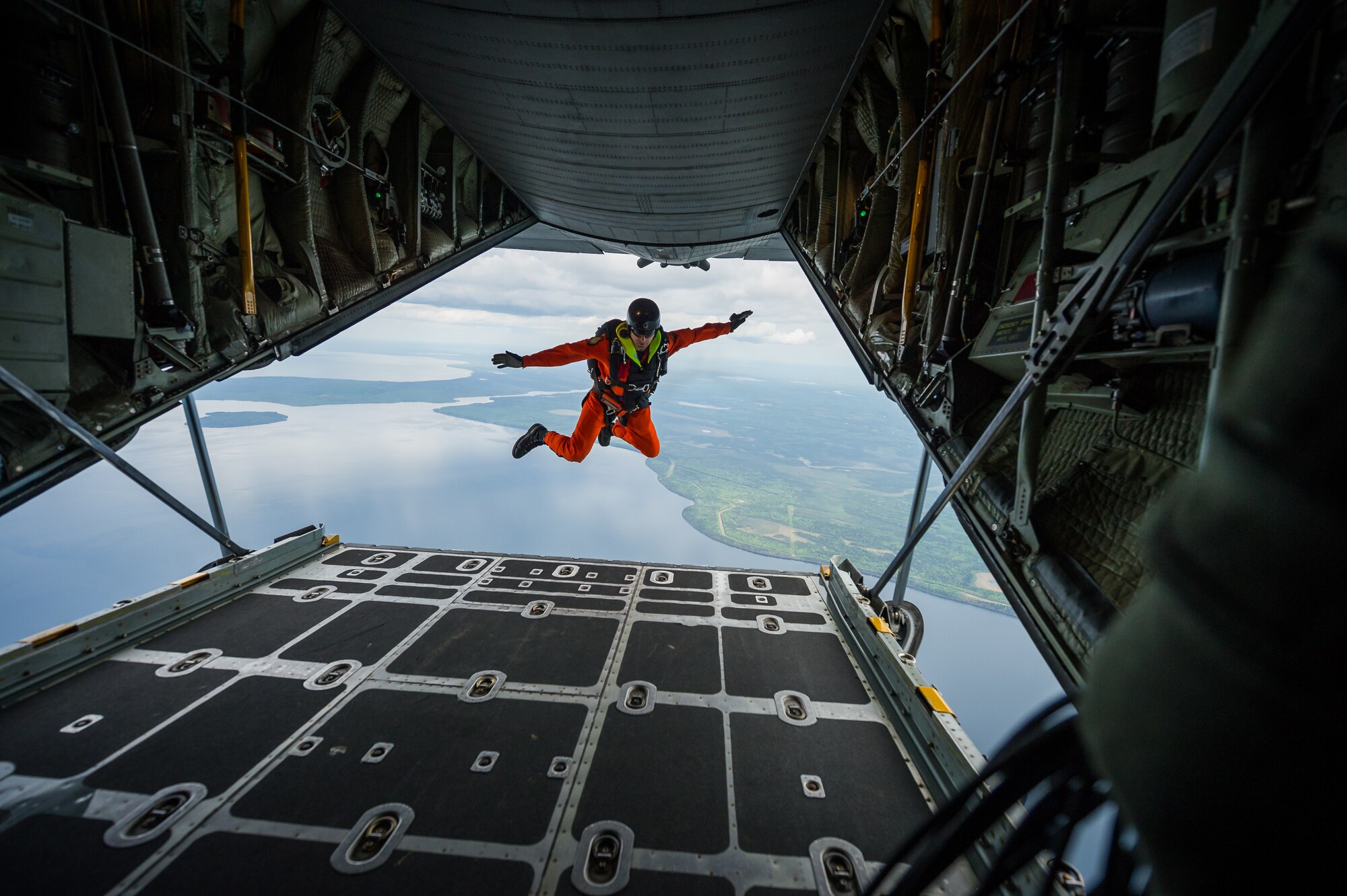Royal Canadian Air Force Master Cpl. Marc Tremblay, search and rescue technician with the 417 Combat Support Squadron, 4 Wing Canadian Forces Base Cold Lake, Cold Lake, Alberta, Canada, jumps out of a C-130 Hercules from the 914th Airlift Wing, Niagara Falls Air Reserve Station, N.Y., during Maple Flag in Edmonton/Cold Lake, Alberta, Canada, June 3, 2014. Maple Flag is an international exercise designed to enhance the interoperability of C-130 aircrews, maintainers and support specialists in a simulated combat environment. (U.S. Air Force photo by Master Sgt. John R. Nimmo, Sr./Released)