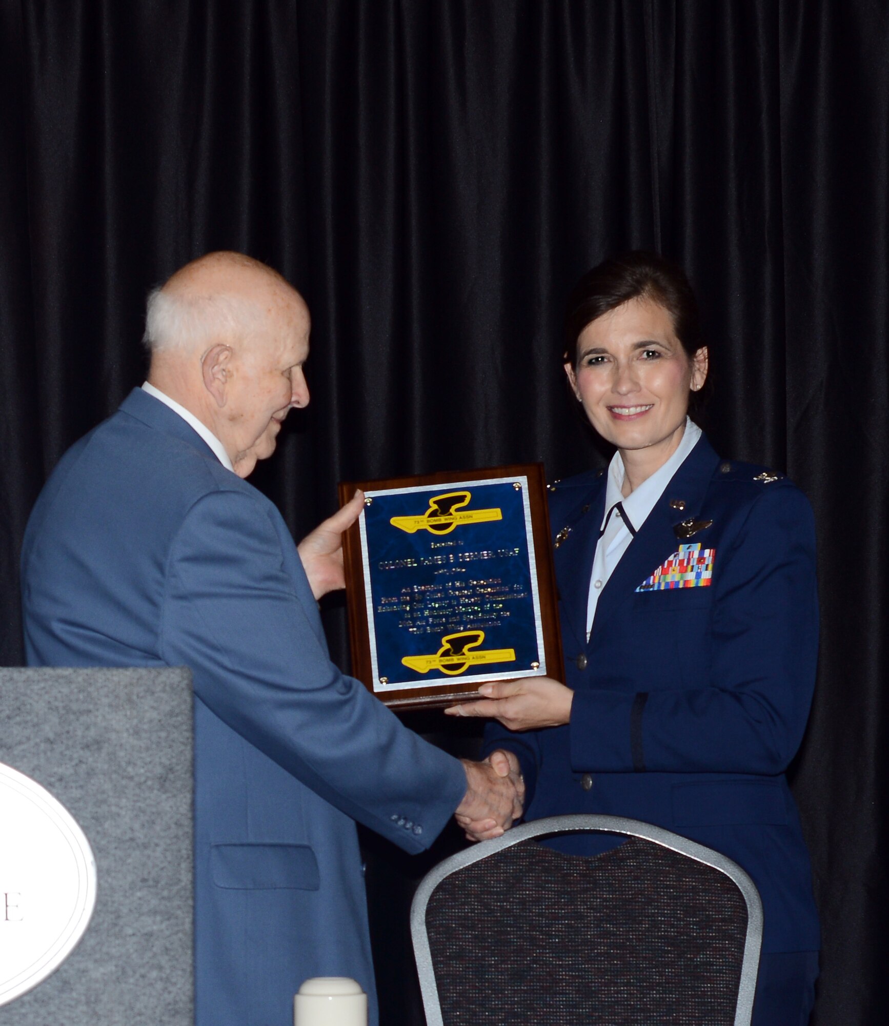 Col. Jennifer Uptmor, 22nd Operations Group commander, speaks at the 73rd Bomb Wing Association 39th annual reunion, May 30, 2014, in Wichita, Kan. Members of the association requested McConnell Air Force Base provide a guest speaker and Uptmor, was selected to speak to the veterans and their families. Uptmor had the honor of being the first female speaker during a 73rd BW reunion event. (U.S. Air Force photo/Airman 1st Class John Linzmeier)