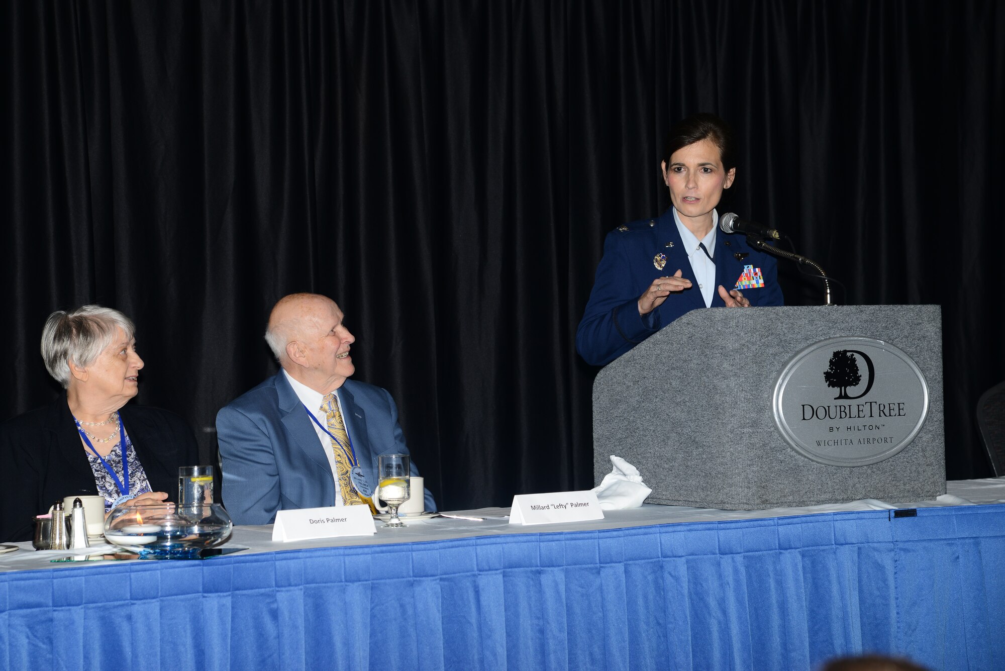 Col. Jennifer Uptmor, 22nd Operations Group commander, speaks at the 73rd Bomb Wing Association 39th annual reunion, May 30, 2014, in Wichita, Kan. Members of the association requested McConnell Air Force Base provide a guest speaker and Uptmor, was selected to speak to the veterans and their families. Uptmor had the honor of being the first female speaker during a 73rd BW reunion event. (U.S. Air Force photo/Airman 1st Class John Linzmeier)