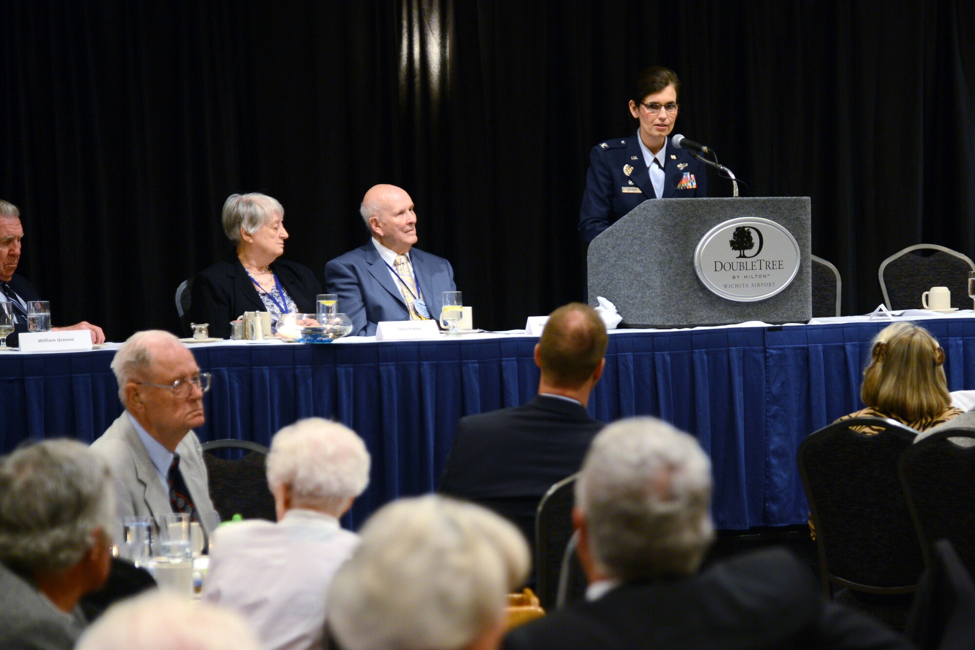 Col. Jennifer Uptmor, 22nd Operations Group commander, speaks at the 73rd Bomb Wing Association 39th annual reunion, May 30, 2014, in Wichita, Kan. Members of the association requested McConnell Air Force Base provide a guest speaker and Uptmor, was selected to speak to the veterans and their families. Uptmor had the honor of being the first female speaker during a 73rd BW reunion event. (U.S. Air Force photo/Airman 1st Class John Linzmeier)