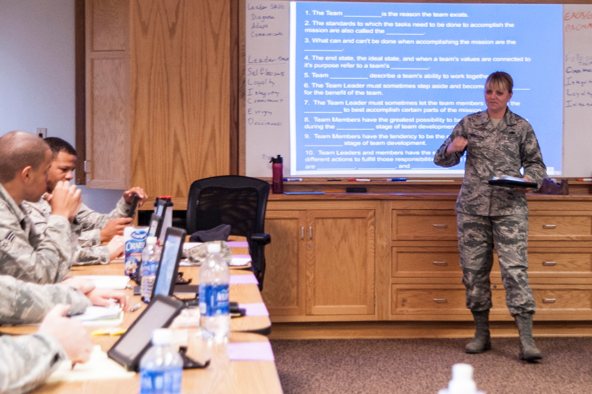 Tech. Sgt. Jennifer Cunningham, 30th Force Support Squadron professional military education instructor, instructs students from the Airman Leadership School June 5, 2014, Vandenberg Air Force Base, Calif. Cunningham is one of two instructors on base who take charge of developing over 120 Airmen passing through ALS year round. (U.S. Air Force photo by Airman 1st Class Yvonne Morales)