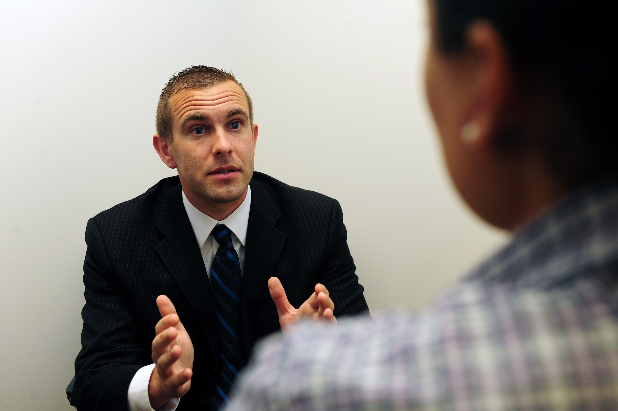 Special Agent Patrick Allen, Air Force Office of Special Investigations, Detachment 216, conducts an interview with an eyewitness as part of an investigation, June 6, 2014, at Seymour Johnson Air Force Base, North Carolina. The AFOSI provides professional investigative service to commanders of all Air Force activities by identifying, investigating and neutralizing criminal, terrorist and espionage threats to Air Force and Department of Defense personnel and resources. (U.S. Air Force photo/Senior Airman John Nieves Camacho)