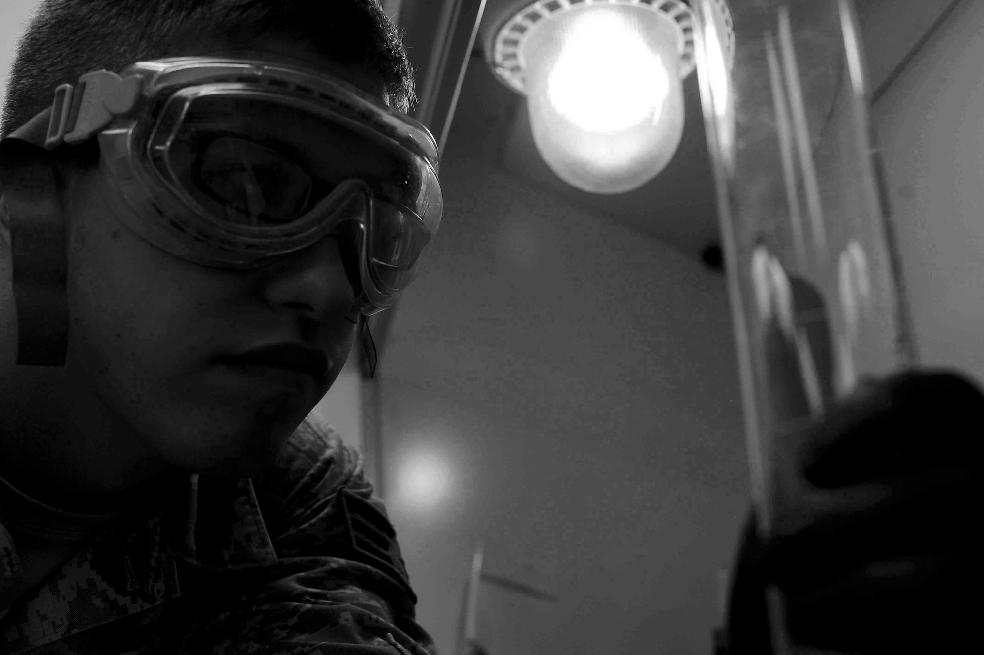 ALTUS AIR FORCE BASE, Okla. – U.S. Air Force Senior Airman Zakkary Wiest, 97th Logistics Readiness Squadron lab technician, inspects fuel samples at the base fuel lab June 3, 2014. Fuels lab technicians provide clean, dry aviation and ground fuel to support the strategic airlift, aerial delivery and air refueling missions of Altus AFB. Fuels specialists maintain 827,000 gallons of fuel and are inspected by the fuels lab before fuel reaches the aircraft.  (U.S. Air Force photo by Senior Airman Jesse Lopez/Released)