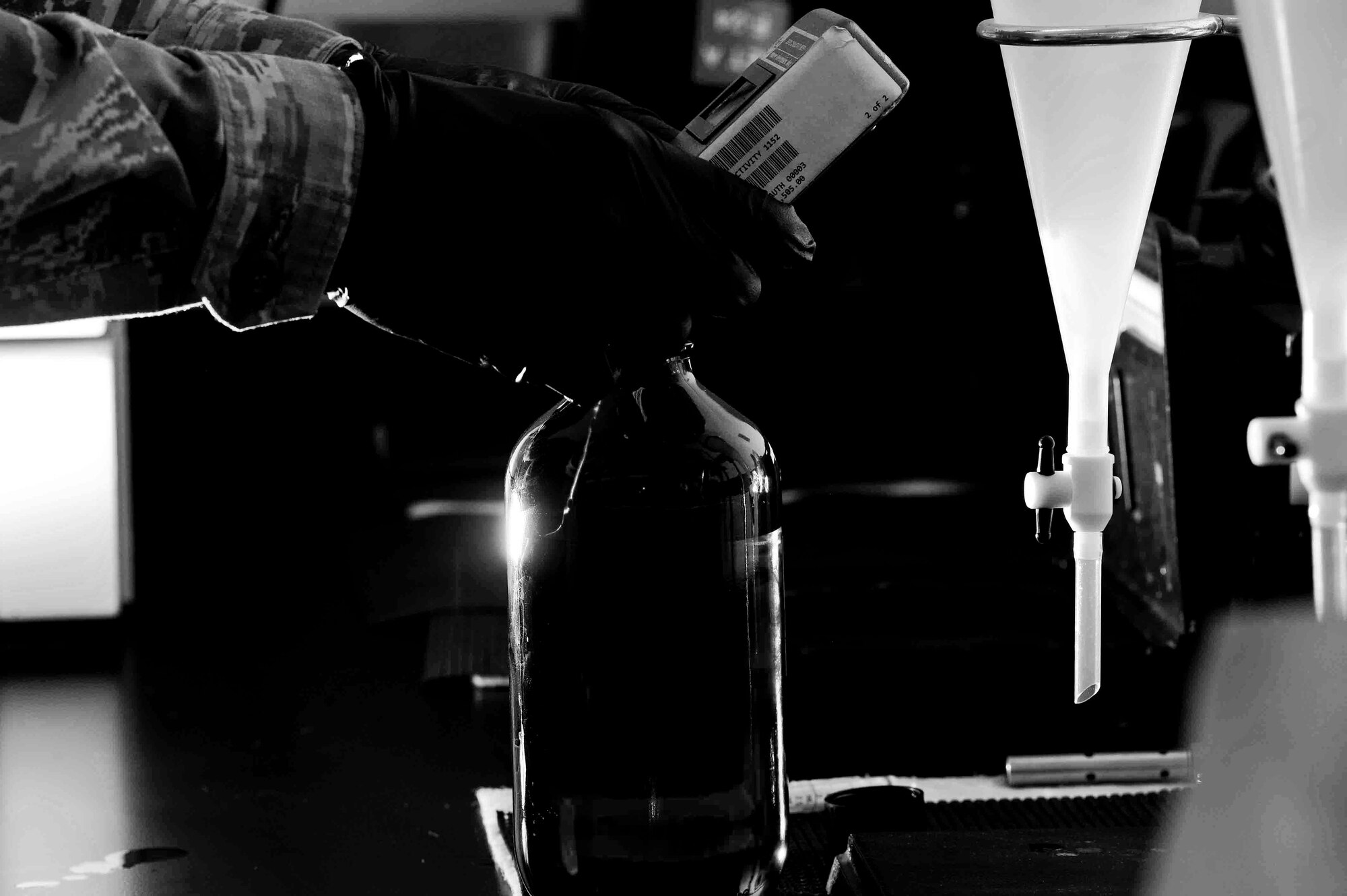 ALTUS AIR FORCE BASE, Okla. – U.S. Air Force Senior Airman Zakkary Wiest, 97th Logistics Readiness Squadron lab technician, tests fuel samples for contaminants at the base fuel lab June 3, 2014. The fuels lab performs approximately 1,100 analyses per month, vital in supporting the 7,900 local sorties and countless transient aircraft annually. Fuels specialists maintain 827,000 gallons of fuel and are inspected by the fuels lab before fuel reaches the aircraft. (U.S. Air Force photo by Senior Airman Jesse Lopez/Released)
