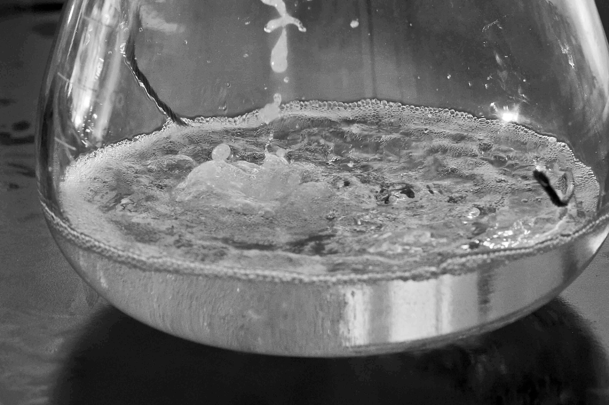 ALTUS AIR FORCE BASE, Okla. – Fuel bubbles as it goes through purification process at the base fuel lab June 3, 2014. Fifty-four million gallons of aviation fuel are issued annually to Altus AFB, which has the largest disbursement of fuel in Air Education and Training Command. The fuels lab performs approximately 1,100 analyses per month, vital in supporting the 7,900 local sorties and countless transient aircraft annually. (U.S. Air Force photo by Senior Airman Jesse Lopez/Released)