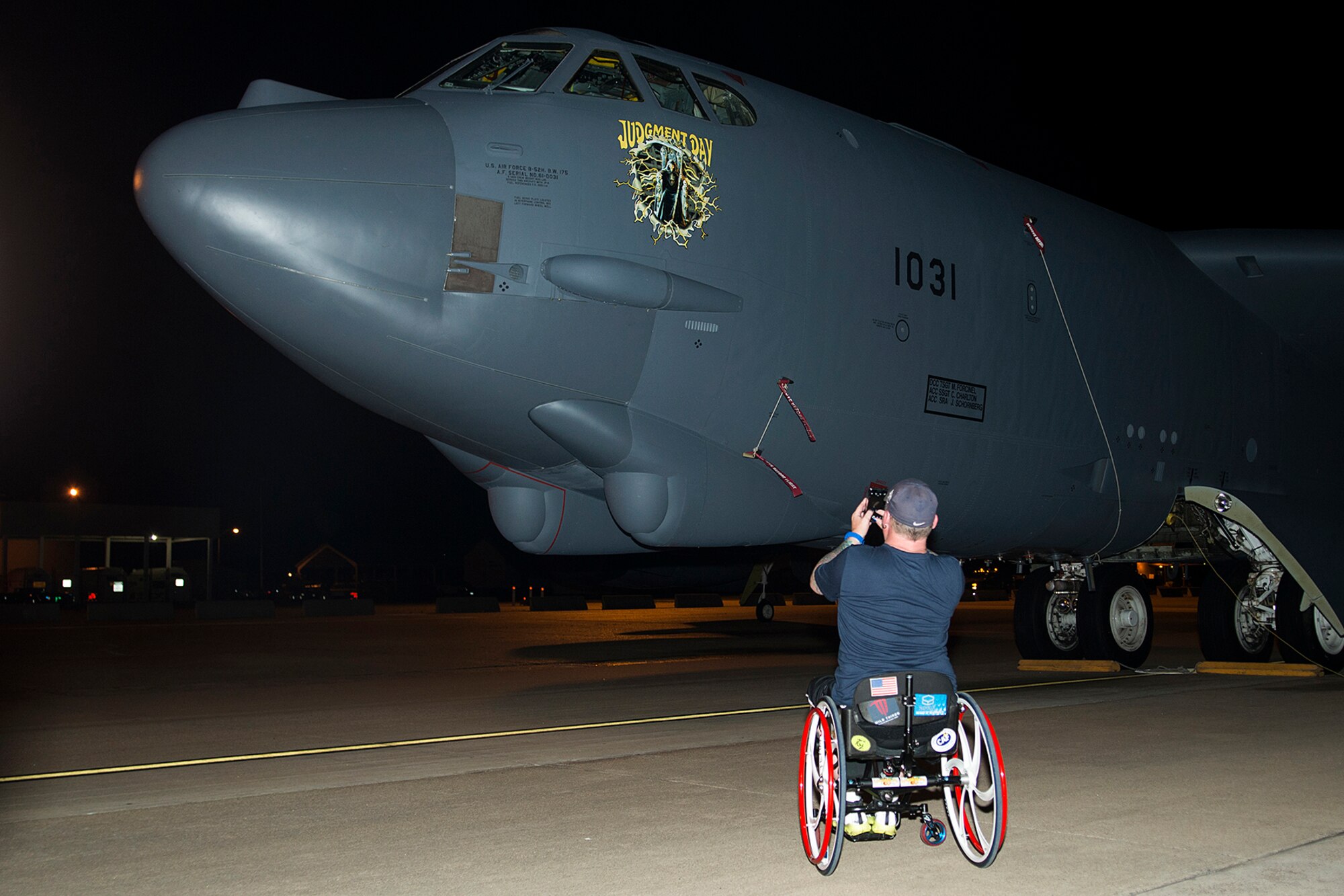 Patrick McDonald takes a photo of a 307th Bomb Wing B-52H Stratofortress after his successful entry and exit from the cockpit during a tour, June 4, 2014, Barksdale Air Force Base, La. McDonald, a U.S. Army veteran and U.S. Paralympic Curling Team captain, joined the American300 Tours to share his experience with fellow military service members as part of the tour's 'Never Quit Series'. (U.S. Air Force photo by Master Sgt. Greg Steele/Released)