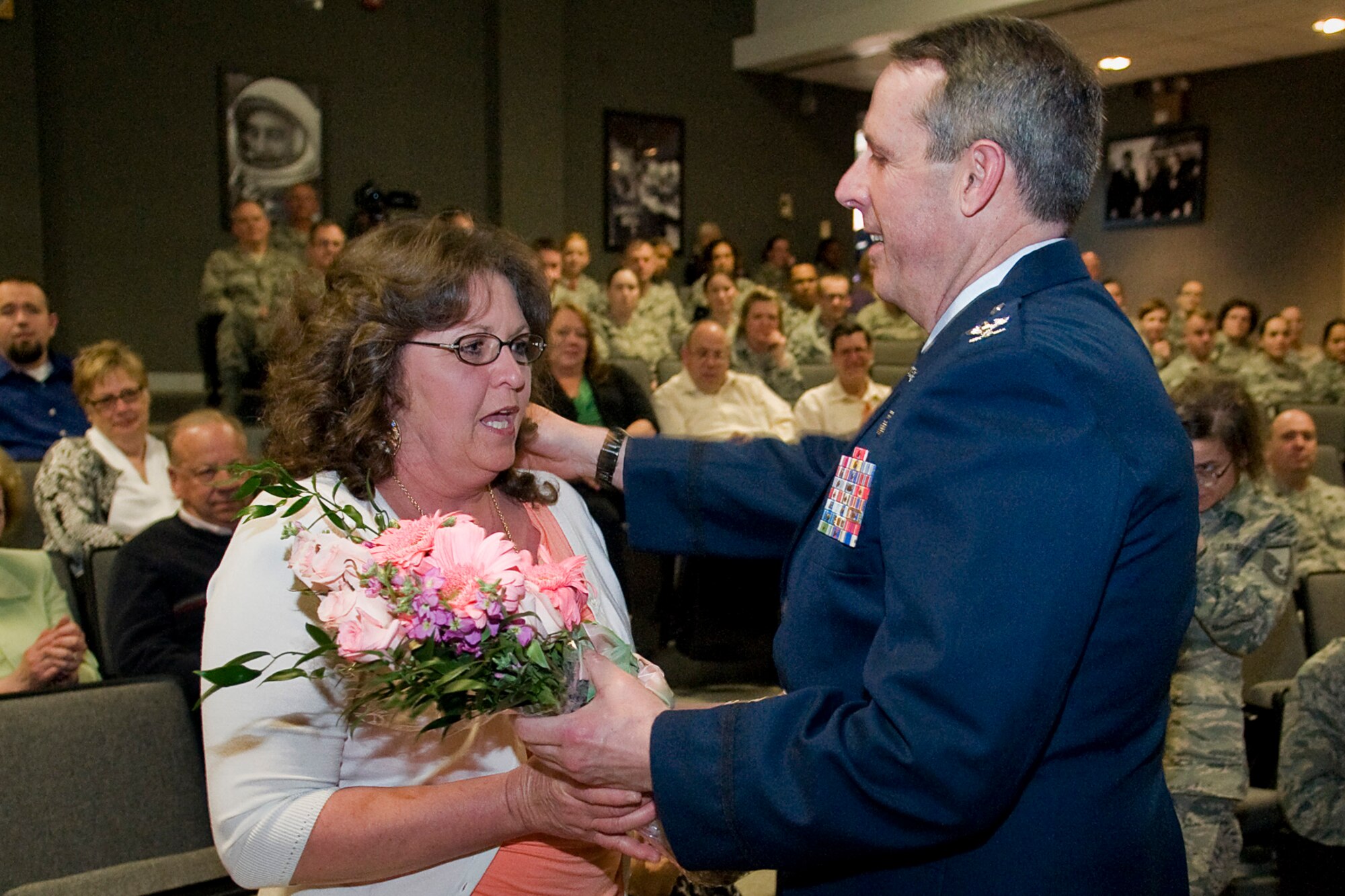 Col. Thomas Collins, 434th Aerospace Medicine Squadron commander, thanks his girlfriend, Chris Kreutzer, during his retirement ceremony at Grissom Air Reserve Base, Ind., April 13, 2014. Collins retired after serving nearly 38 years in both the regular Air Force and Air Force Reserve. (U.S. Air Force photo/Tech. Sgt. Mark R. W. Orders-Woempner) 
