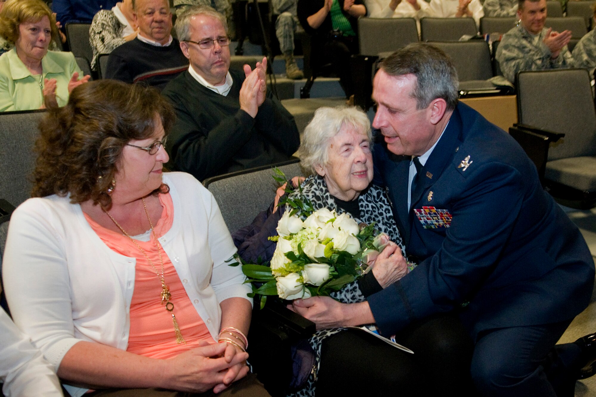 Col. Thomas Collins, 434th Aerospace Medicine Squadron commander, thanks his mother during his retirement ceremony at Grissom Air Reserve Base, Ind., April 13, 2014. Collins retired after serving nearly 38 years in both the regular Air Force and Air Force Reserve. (U.S. Air Force photo/Tech. Sgt. Mark R. W. Orders-Woempner) 

