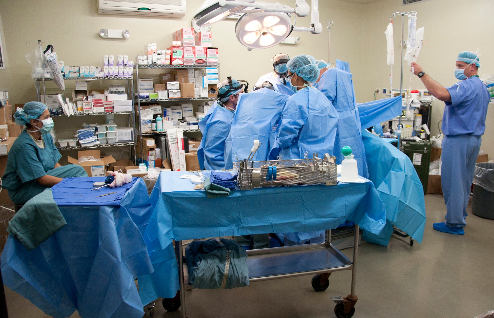 A U.S. Air Force urology surgery team operates on a Belizean patient in a Karl Heusner Memorial Hospital operating room May 27, 2014, at the hospital in Belize City, Belize. KHMH has played a crucial role in the New Horizons Belize 2014 surgical readiness training exercises by hosting the surgery teams, providing space, and screening local and regional patients. New Horizons is a multinational exercise that offers Belizean, Canadian and U.S. professionals valuable training opportunities in health care professions, as well as civil engineering. (U.S. Air Force photo by Tech. Sgt. Kali L. Gradishar/Released)