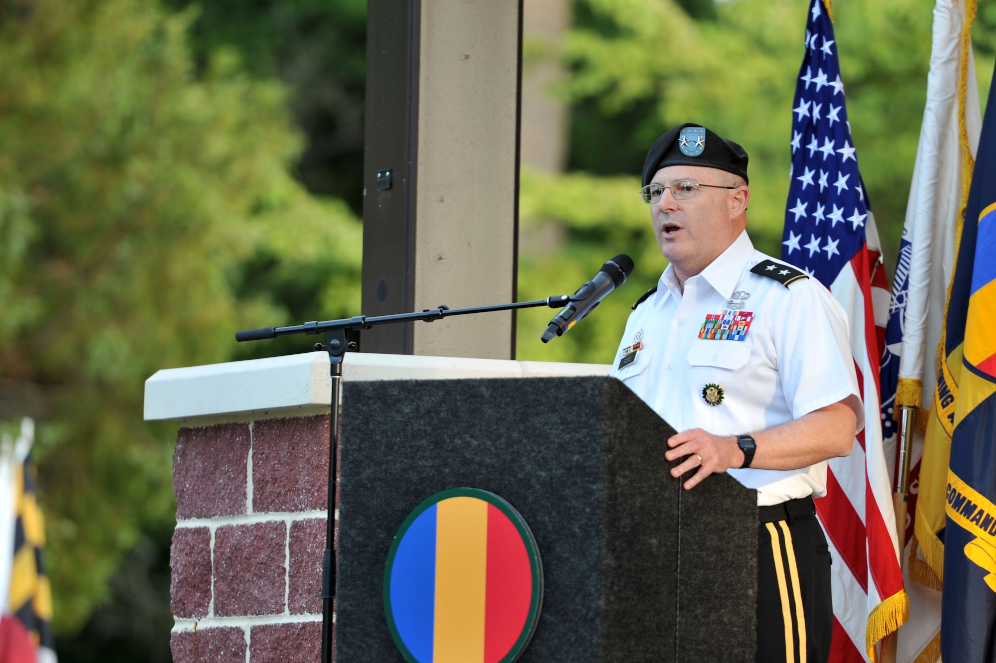 U.S. Army Maj. Gen. Ross E. Ridge, deputy commanding general of Army Initial Military Training, gives remarks during the Training and Doctrine Command Band’s Music Under the Stars opening concert at Fort Eustis, Va., June 5, 2014.  Through its weekly summer concerts, the series aims to provide a diverse repertoire, featuring Jazz, funk, Salsa and Latin music. (U.S. Air Force photo by Staff Sgt. Katie Gar Ward/Released)