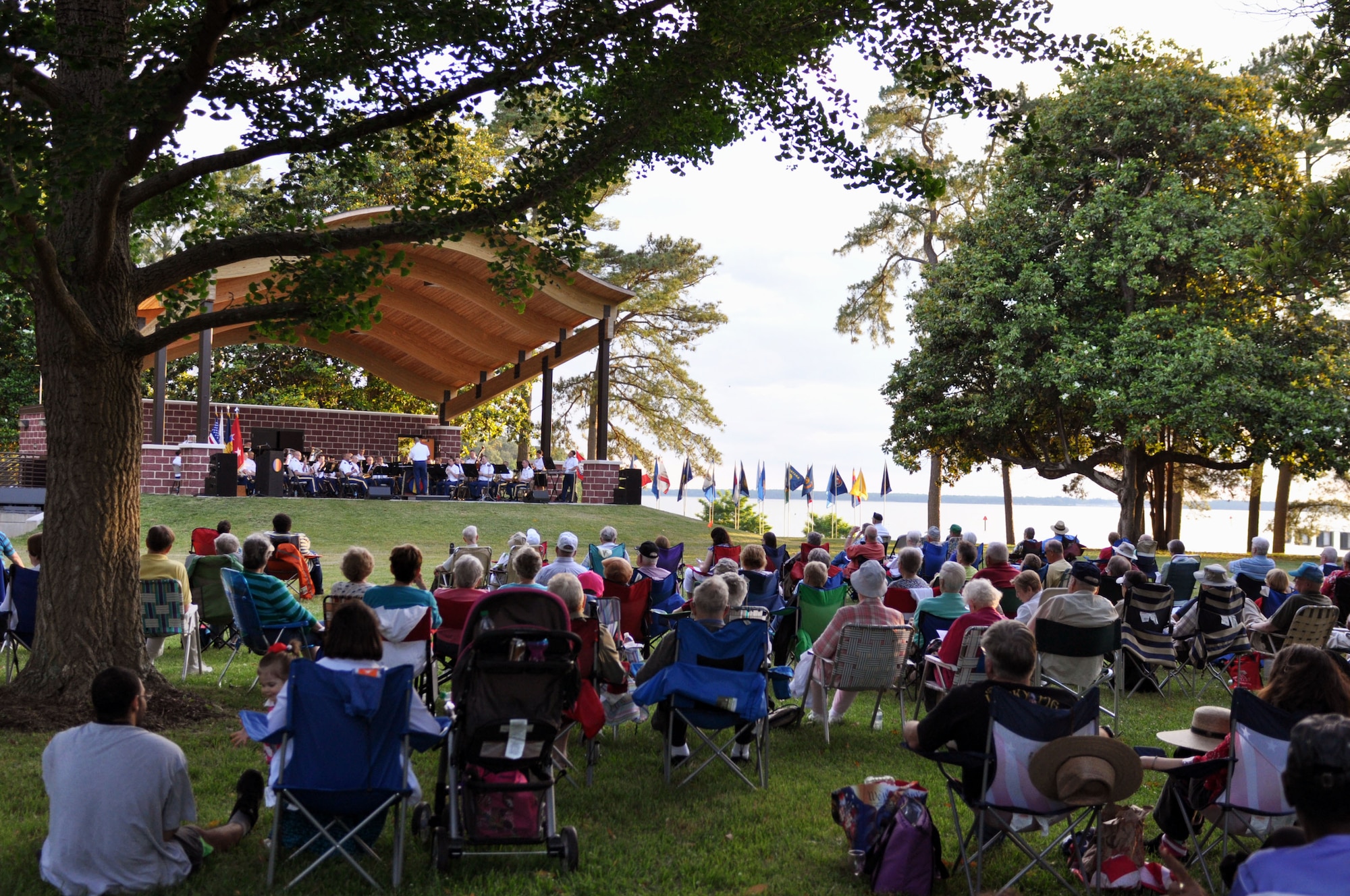 More than 200 people attended the opening of the U.S. Army Training and Doctrine Command Band’s 82nd season of the Music Under the Stars summer concert series at Fort Eustis, Va., June 5, 2014. The concert was the first of 12 free public concerts scheduled every Thursday through August, and included performances of Sparke’s “Sunrise at Angel’s Gate,” Leroy Anderson’s “Blue Tango,” and Samuel Ward’s “America the Beautiful.” (U.S. Air Force photo by Staff Sgt. Katie Gar Ward/Released)