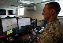 Staff Sgt. Brett Walker, 690th Network Support Squadron Detachment 3 senior crew chief, checks the Information Assurance Officer (IAO) Express for completed trouble tickets in the NSS building on Joint Base Pearl Harbor-Hickam, Hawaii, June 3, 2014. The IAO Express was brought online to assist the Enterprise Service Desk with quickly resolving the more than 10,000 account related requests from customers. (U.S. Air Force photo/Tech. Sgt. Terri Paden)