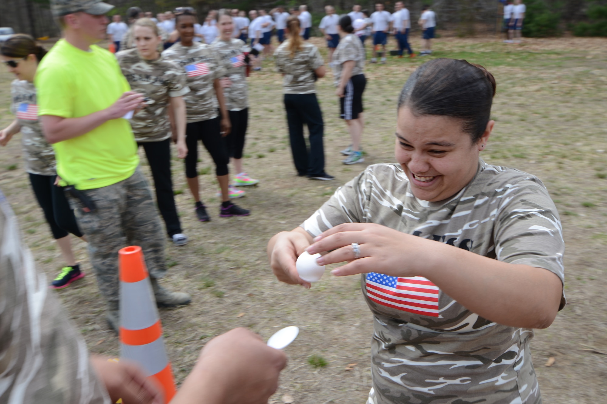 Staff Sgt. Selva Cabrera with the 103rd Force Support Squadron carefully transfers an uncooked egg onto her teammate’s spoon during the second annual Yankee Warrior Day at Bradley Air National Guard Base, East Granby, Conn., May 3, 2014. The event included various team challenges to promote esprit de corps and physical fitness. (U.S. Air National Guard photo by Tech. Sgt. Joshua Mead)
