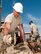 H.E. HOLT NAVAL COMMUNICATION STATION, Australia – Senior Master Sgt. Anthony Liberty, structures superintendent for the Alaska Air National Guard’s 176th Civil Engineer Squadron, smooths freshly poured concrete for an oil-containment wall here May 14, 2014. Thirty-four Alaska Air Guard members, most from the 176th CES, deployed for three weeks to this tiny outpost in Western Australia to help build a space radar facility to be jointly operated by Australia and the United States. National Guard photo by Capt. John Callahan.