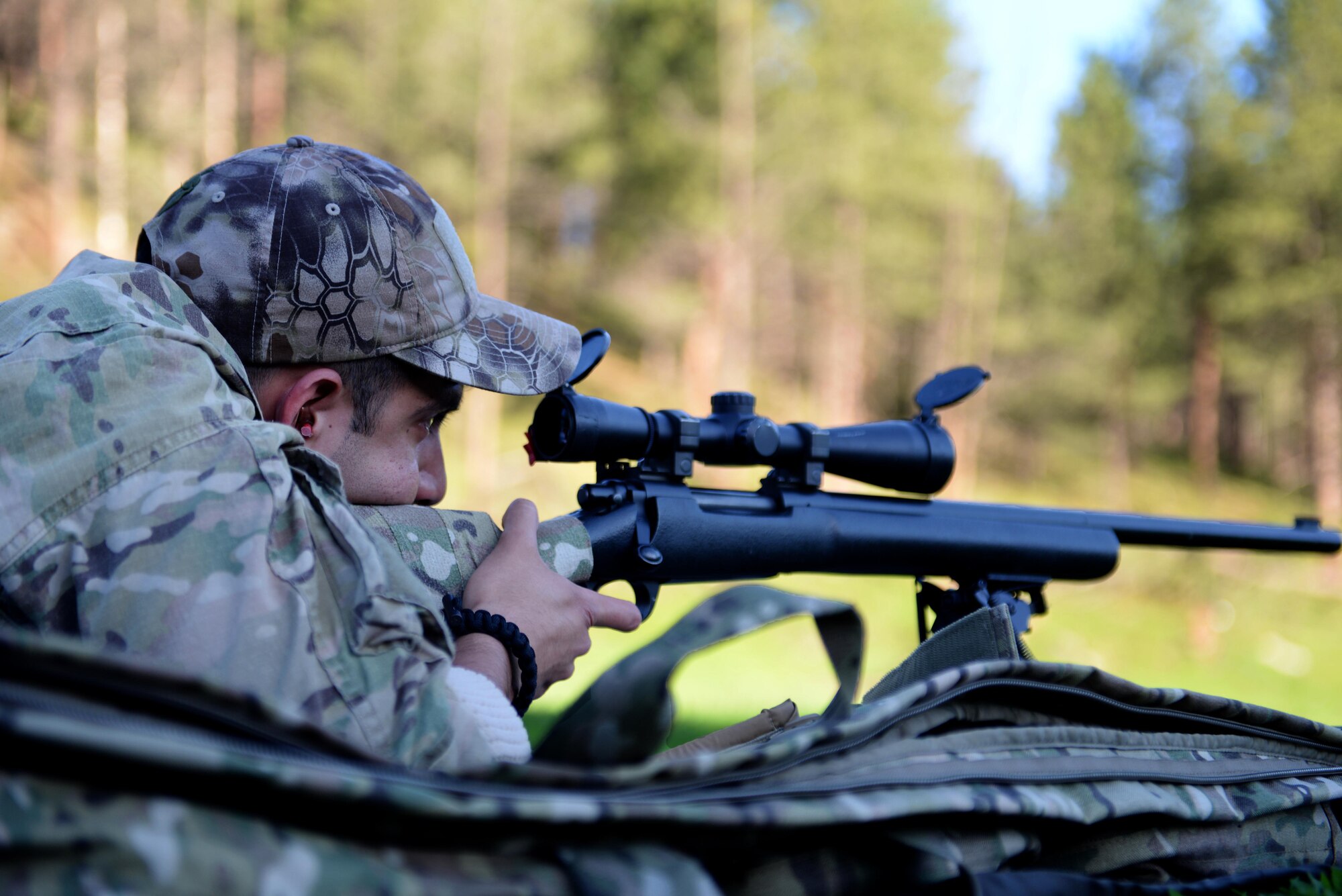 Staff Sgt. Edgar Cerrillo, 28th Security Forces Squadron unit orientation training instructor, fires an M-24 sniper rifle while at an outdoor shooting range in Rapid City, S.D., May 29, 2014. Cerrillo is one of three security forces Airmen selected to participate in the South Dakota advanced sniper course in June. (U.S. Air Force photo by Airman 1st Class Rebecca Imwalle/ Released)