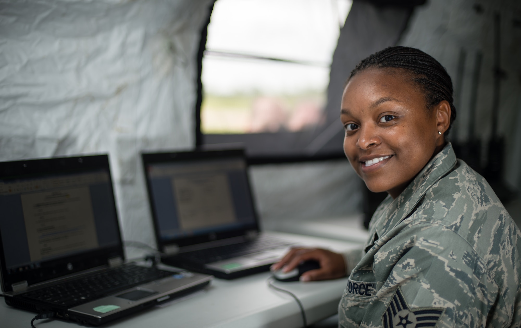 Tech. Sgt. Marquita Wilson, 435th Air Ground Operation's Air Mobility Squadron's contingency response controller, a Sylacauga, Alabama native, works as link in tracking incoming and outgoing aircraft, keeping an operational airfield aware and operating in Cherbourg, France, June 3, 2014. What motivates Wilson is a drive to to make a piece of history and ensuring the proper honor is paid veterans accordingly. (U.S. Air Force photo/Airman 1st Class Jordan Castelan)