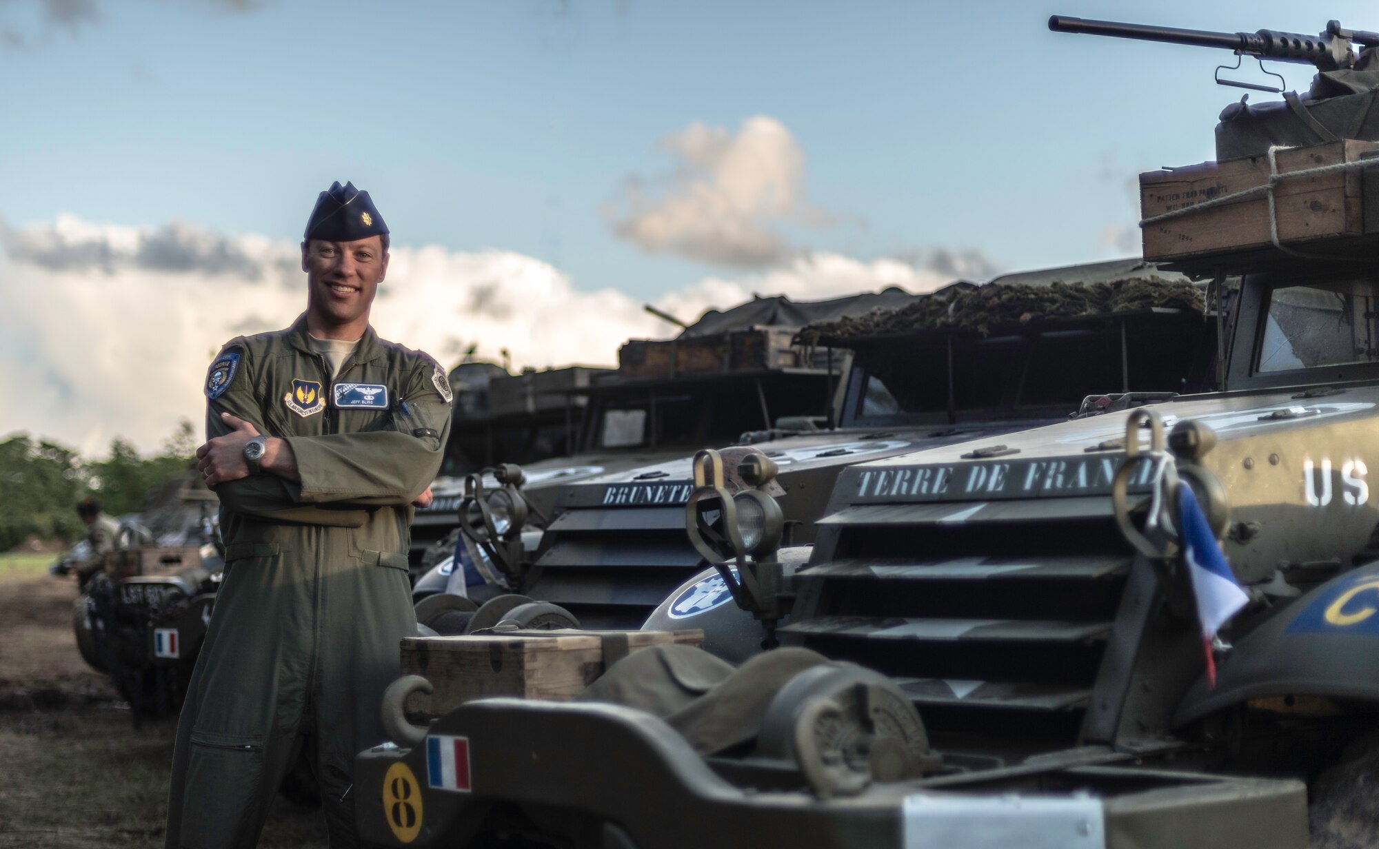 Maj. Jeff Bliss, 37th Airlift Squadron pilot, takes a photo with World War II-era memorabilia in Caretan, France, June 4, 2014. Over 60 Ramstein Airmen have traveled to Normandy, France to celebrate and honor the sacrifices made by veterans of World War II. (U.S. Air Force photo/Airman 1st Class Jordan Castelan)