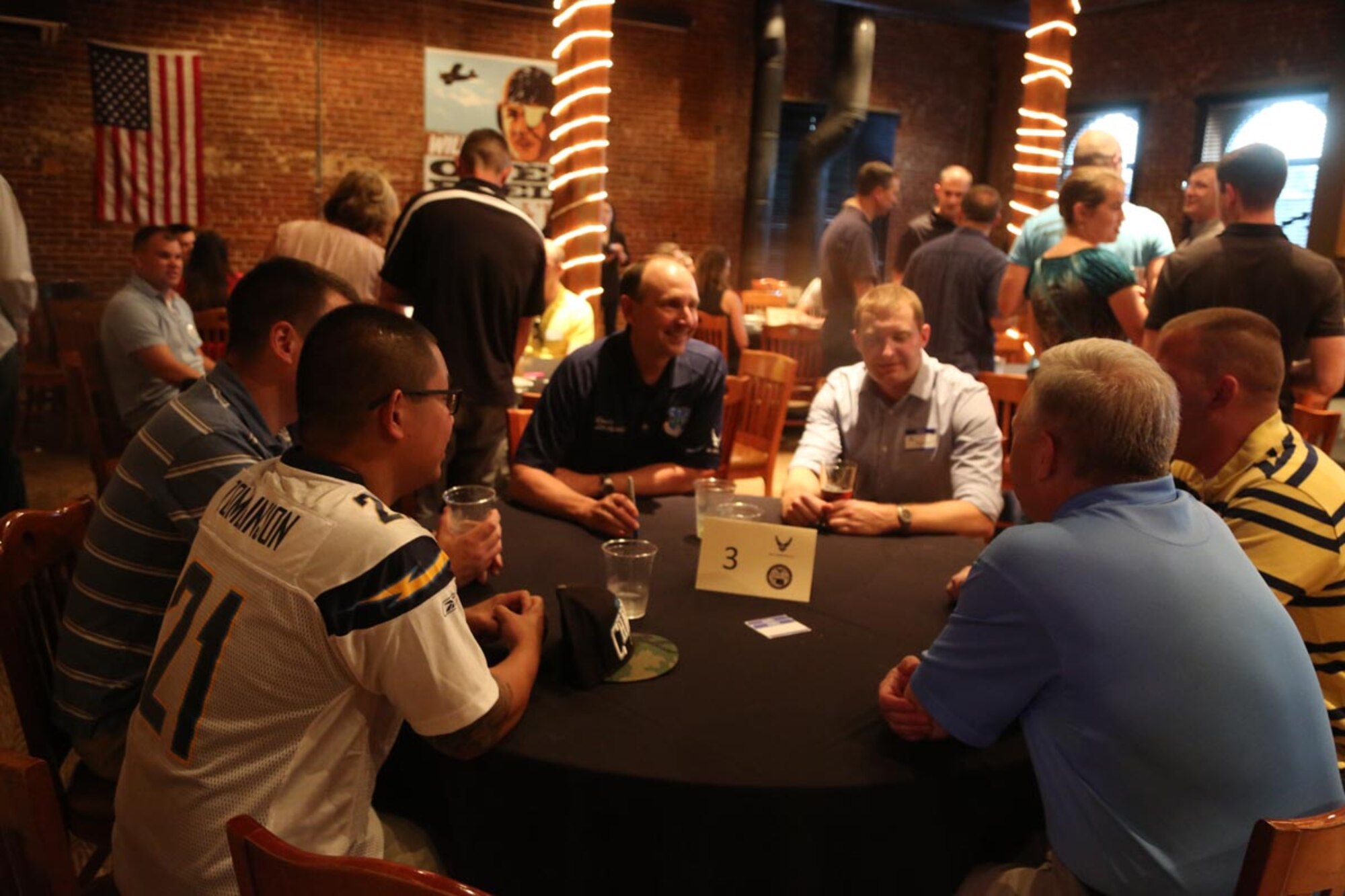 Lt. Gen. Bruce Litchfield, Air Force Sustainment Center commander, left center, and Maj. Gen. John Thompson, Air Force Program executive officer for Tankers, right center, talk with company grade officers, Capt. Alex Jurgermeyer, Capt. Benjamin Quigley, Capt. Christopher Lemque and 1st Lt. Keith Hudson at a “speed mentoring” session in downtown Oklahoma City.  (Air Force photo by 2nd Lt. Lauren Guiterrez)
