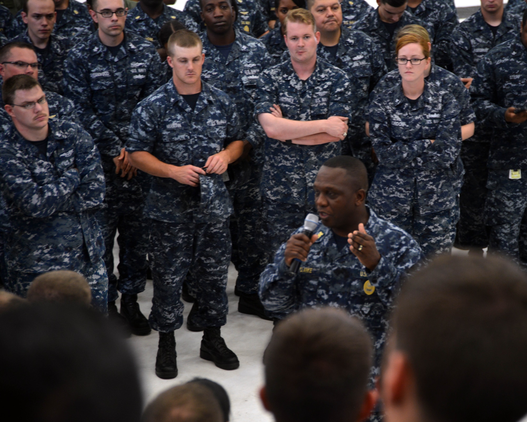 U.S. Fleet Forces Fleet Master Chief Charles “Chuck” Clarke, U.S. Fleet Forces Command, talks with Sailors during a TACAMO (Take Charge And Move Out) all-hands call last week. He discussed the current status of the Navy and fielded questions about Sailors’ concerns.  TACAMO is responsible to Commander Naval Air Forces for manning, training and equipping the Navy squadrons responsible for nuclear command and control communications to the nation’s nuclear triad mission. (Navy photo by Petty Officer 2nd Class Steven Raymer)