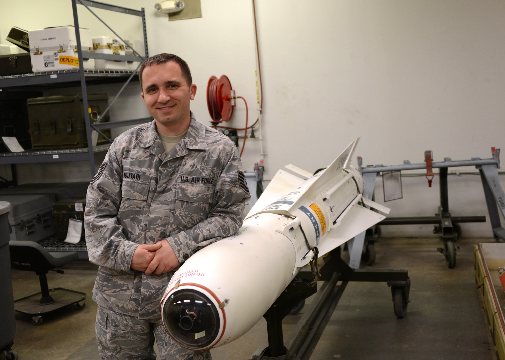 U.S. Air Force Tech. Sgt. Ilir Kojtari, precision guided munitions section non-commissioned officer in charge (NCOIC), 175th Wing Maryland Air National Guard, stands next to an AGM-65A missile maintenance trainer at Warfield Air National Guard Base, Baltimore, Maryland, May 15, 2014. The missile trainer is a non-explosive device that is used to train maintenance personnel on the weapon system.  (U.S. Air National Guard photo by Tech. Sgt. Christopher Schepers/RELEASED)