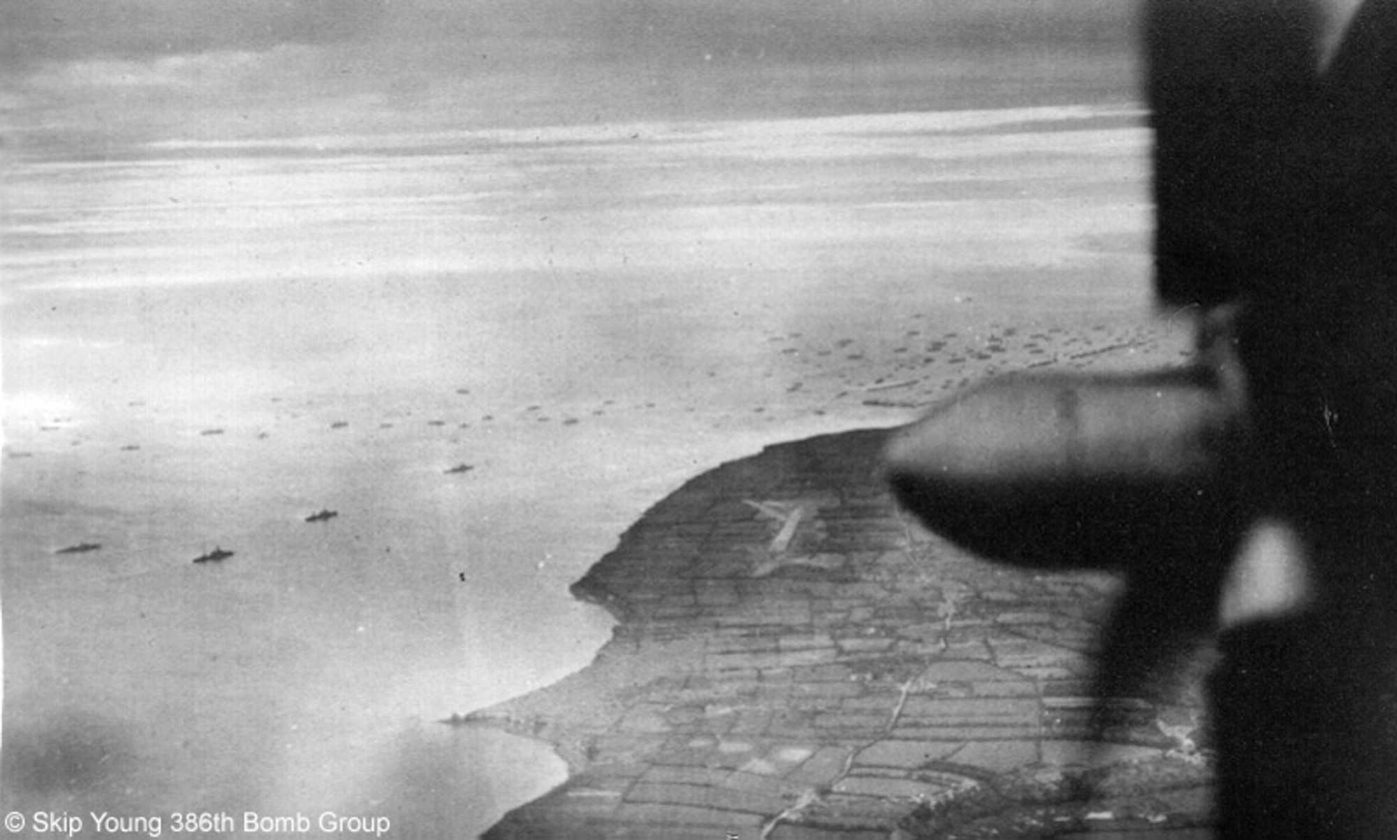 A Martin B-26 Marauder from the 386th Bombardment Group flies over the coast of Normandy, France during D-Day, June 6, 1944. (Courtesy photo from Skip Young)