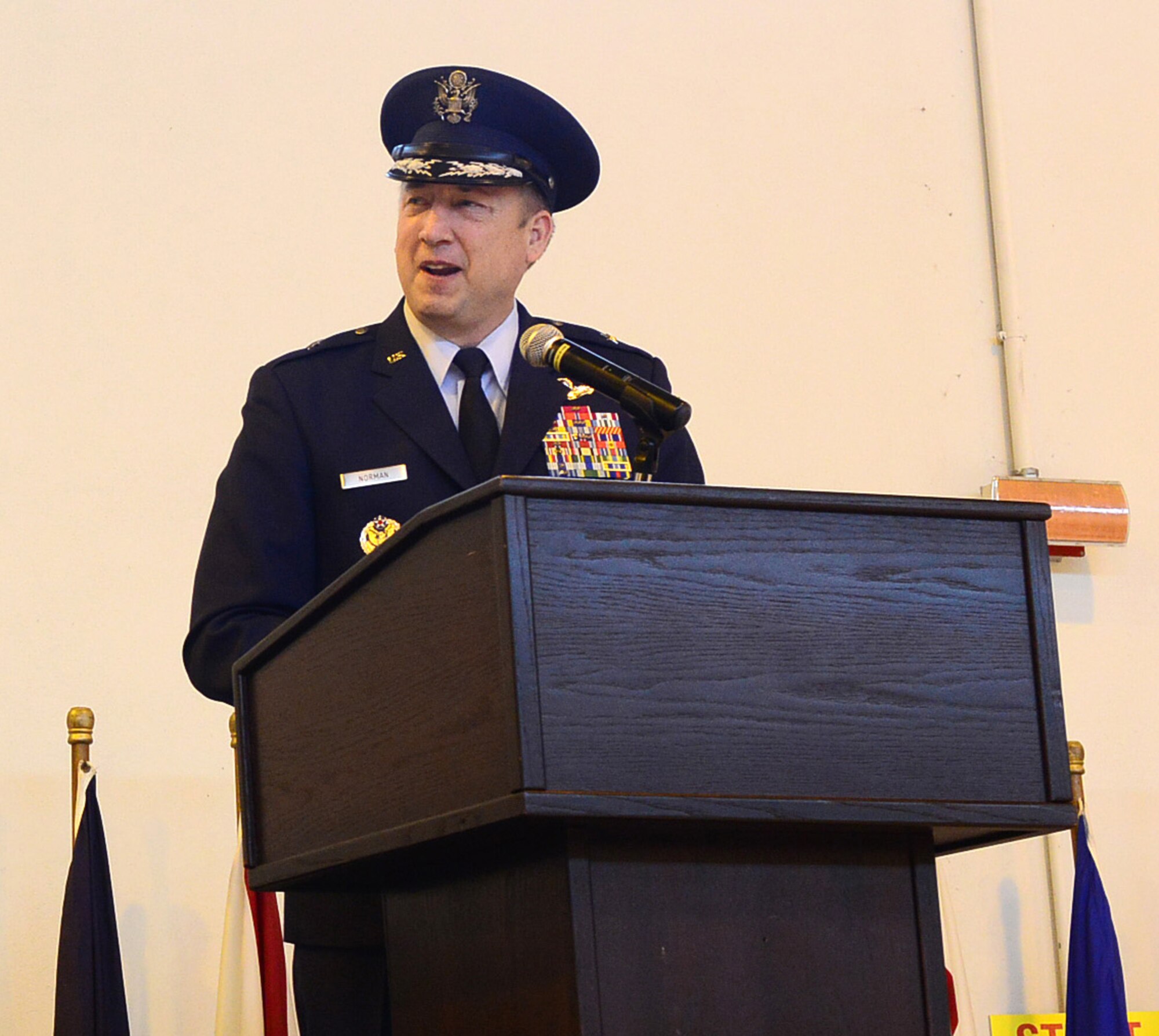 Brig. Gen. Jon A. Norman, 31st Fighter Wing commander, speaks to Team Aviano members during the wing change of command ceremony May 30, 2013, at Aviano Air Base, Italy. Nearly 1,000 people attended the ceremony held in Hangar 3 and the audience included Airmen, Soldiers, Italian air force members and local community leaders. (U.S. Air Force photo/Airman 1st Class Matthew Lotz)