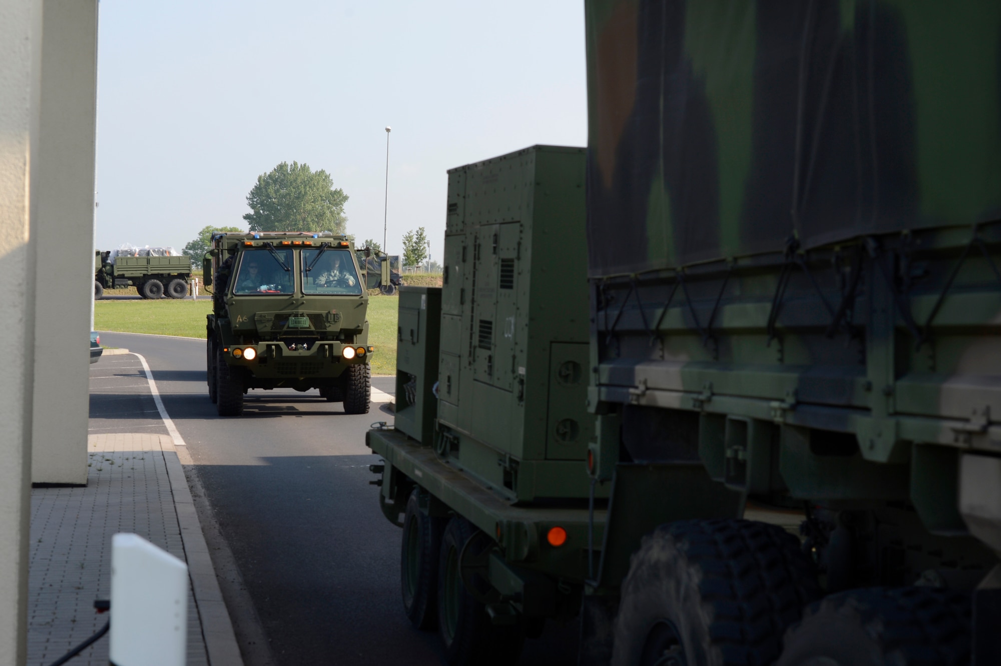 A 606th Air Control Squadron convoy departs Spangdahlem Air Base, Germany, June 2, 2014, to U.S. Air Force Aviation Detachment, Poland, for a planned aviation rotation. The 606th ACS will be supporting the Av-Det as well as participating in exercise Baltic Operations 2014. (U.S. Air Force photo by Staff Sgt. Christopher Ruano/Released)