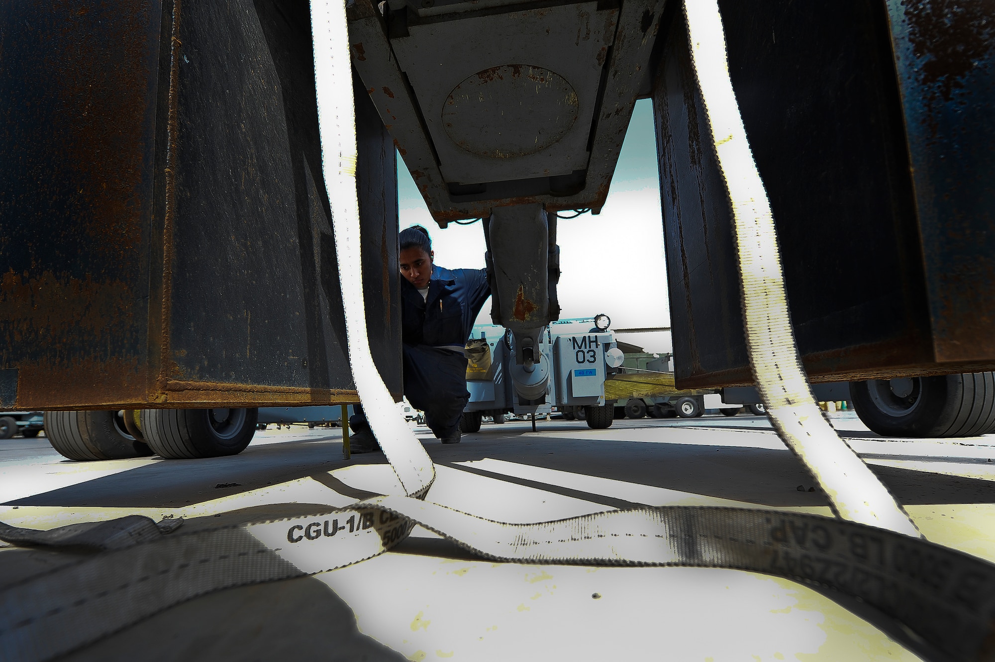Staff Sgt. Kirsten Leon, a 380th Aerospace Ground Equipment journeyman, performs a load test on a munitions handling lift truck June 4, 2014, at an undisclosed location in Southwest Asia. The truck was undergoing a bi-annual phase inspection. (U.S. Air Force photo by Tech. Sgt. Russ Scalf/Released)