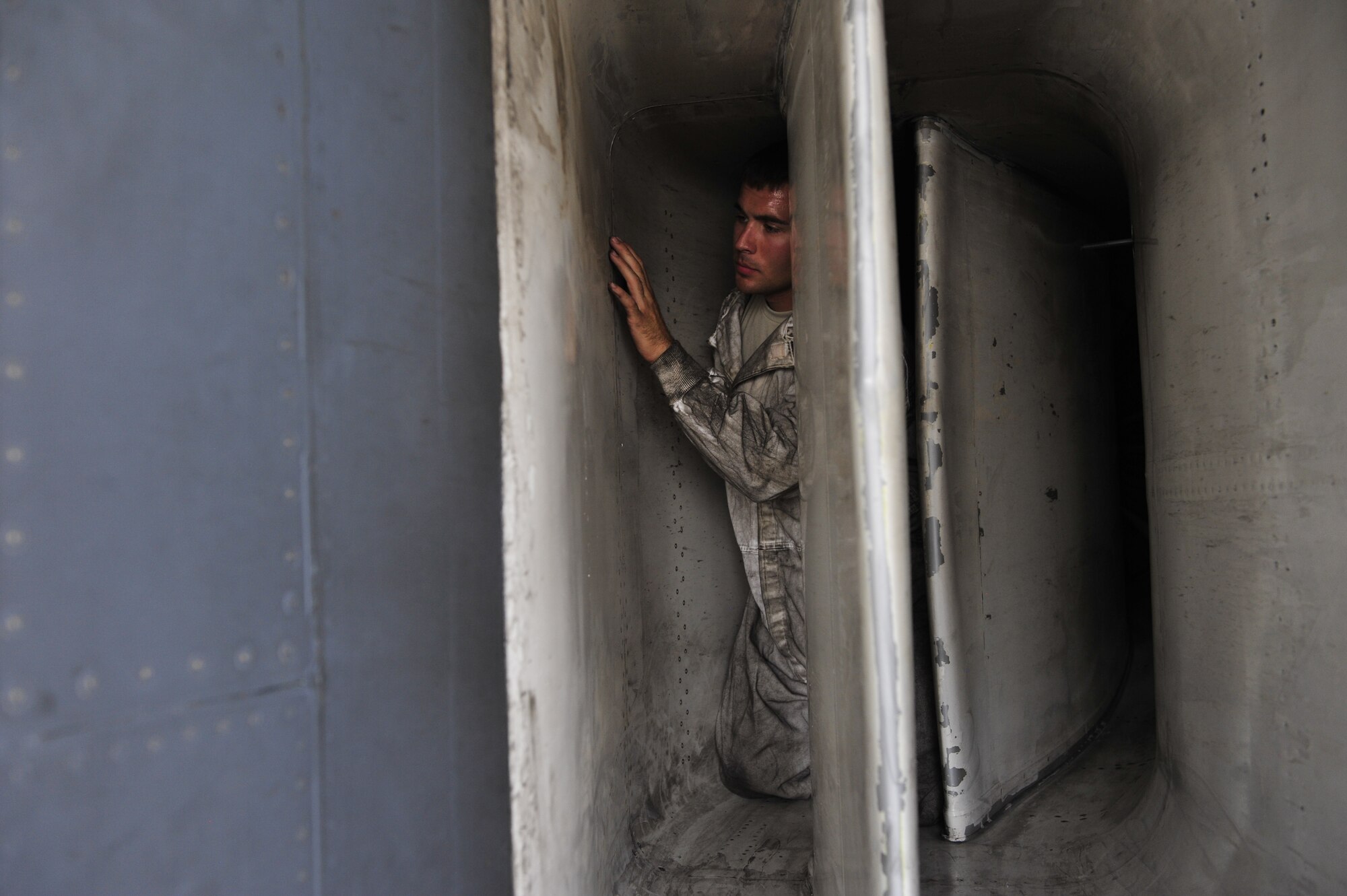 U.S. Air Force Staff Sgt. David Baker, 379th Expeditionary Aircraft Maintenance Squadron crew chief, inspects the rivets in the radar tunnel on a B-1B Lancer at Al Udeid Air Base, Qatar, May 21, 2014. Baker is an overall jet maintainer, responsible for launching, recovering and refueling the aircraft. Baker’s home station is Ellsworth Air Force Base, South Dakota, and his hometown is Rochester New York.  (U.S. Air Force photo by Senior Airman Colin Cates)