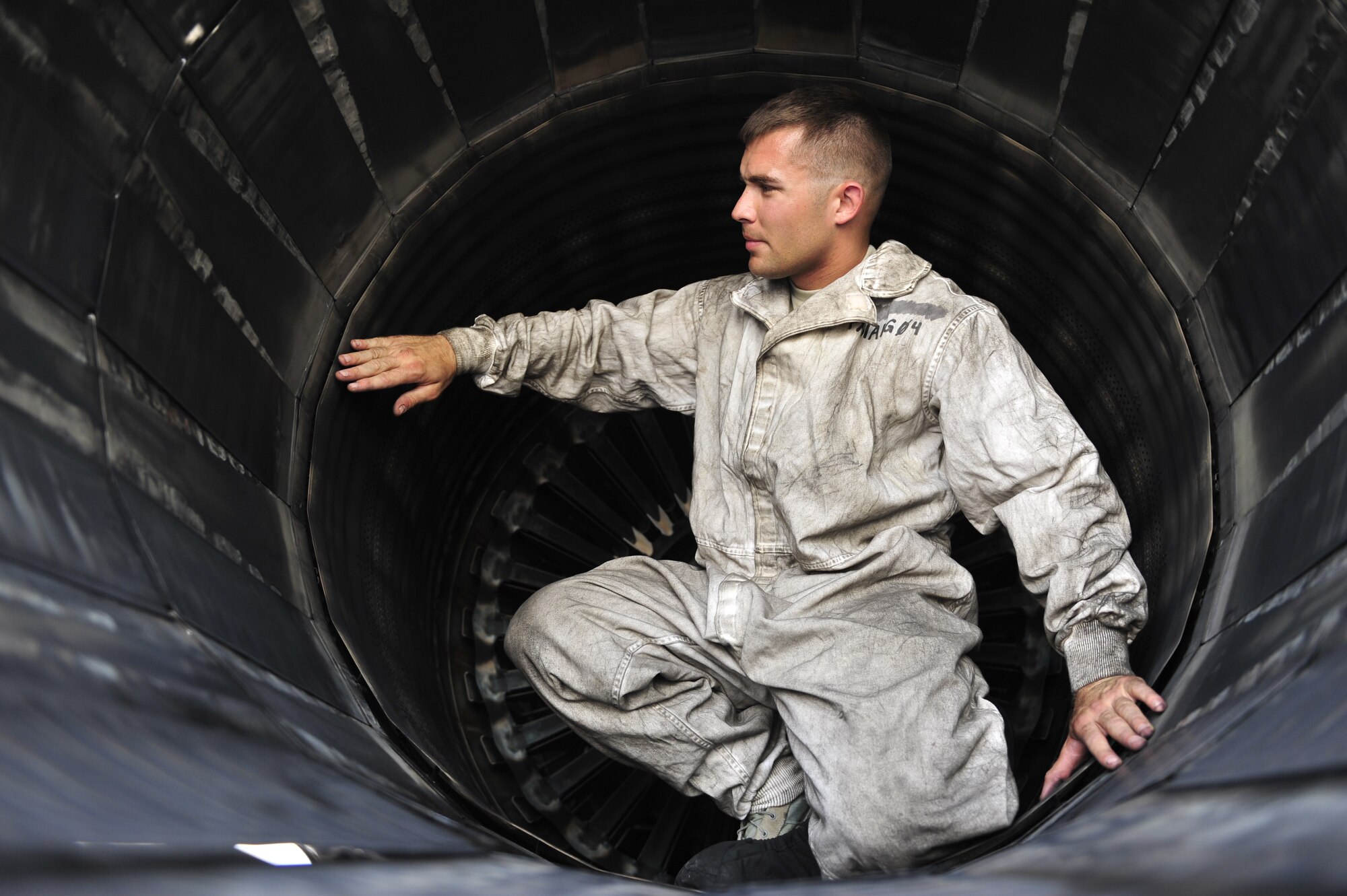 U.S. Air Force Staff Sgt. David Baker, 379th Expeditionary Aircraft Maintenance Squadron crew chief, inspects the engine exhaust for a B-1 Lancer at Al Udeid Air Base, Qatar, May 21, 2014. The B-1 was developed in the 1970s as a supersonic strategic bomber. Baker’s home station is Ellsworth Air Force Base, South Dakota and, his hometown is Rochester, New York.  (U.S. Air Force photo by Senior Airman Colin Cates)