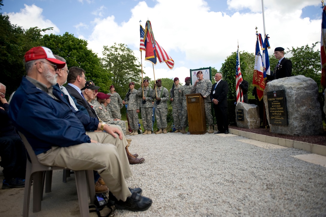 Army Col. Trevor J. Bredenkamp, commander of 1st Brigade Combat Team, 82nd Airborne Division, speaks at a ceremony in Amfreville, France, June 4, 2014, commemorating U.S. Army Lt. Col. Charles J. Timmes, the commander of 2nd Battalion, 507th Parachute Infantry Regiment, 82nd Airborne Division. U.S. Army Photo by Sgt. Daniel Cole