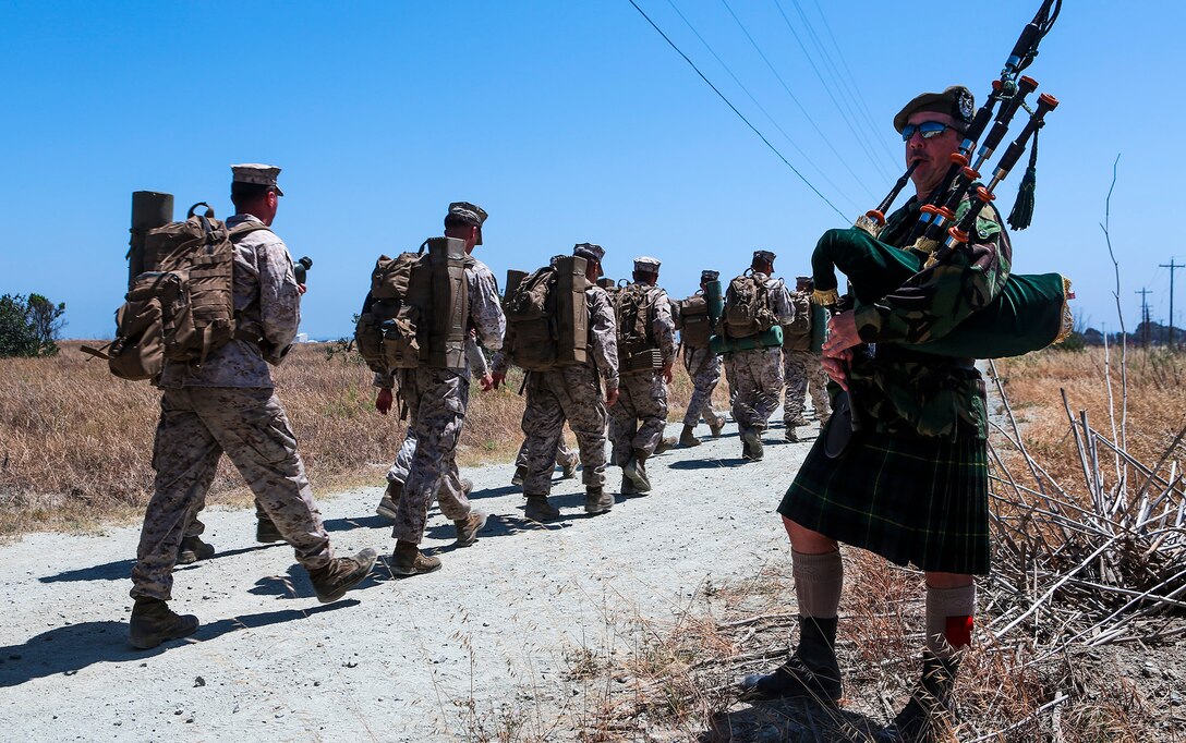 Marines with 1st Light Armored Reconnaissance Battalion, 1st Marine Division, I Marine Expeditionary Force, hike nearly 5 miles from Camp Las Flores to Red Beach, aboard Camp Pendleton, Calif., Jun 5, 2014.   Upon arrival at Red Beach, 1st LAR held the annual Highlander Games Warrior Night, a battalion tradition with the purpose of building unit camaraderie and esprit de corps. 