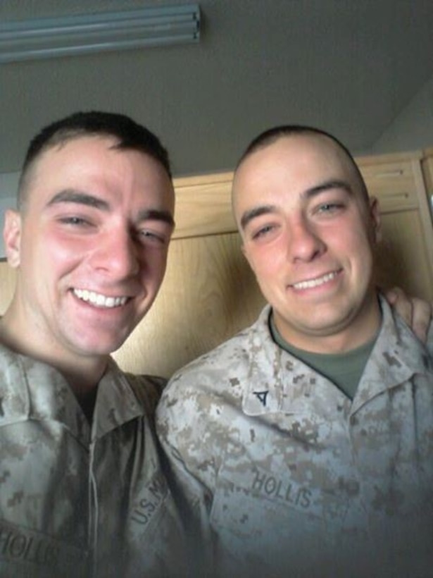 Lance Cpl. Jonathan Hollis, right, a native of Grand Rapids, Michigan, takes a photo with his brother, Lance Cpl. William Hollis, at Marine Corps Air Ground Combat Center Twentynine Palms, California. Hollis, an anti-tank missileman with Weapons Company, 1st Battalion, 7th Marine Regiment, is currently deployed to Helmand province, Afghanistan. He earned a combat meritorious promotion to corporal, June 2, 2014.