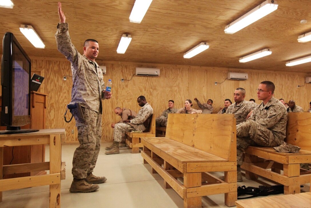 Petty Officer 2nd Class David Tadlock, a religious program specialist with Regional Command (Southwest), teaches Marines about the effects of stress during an Operational Stress Control and Readiness class aboard Camp Leatherneck, Afghanistan, May 29, 2014. During the OSCAR class, Marines discussed the signs of high-level stress and proper paths to treat the symptoms and get the individual back on track.