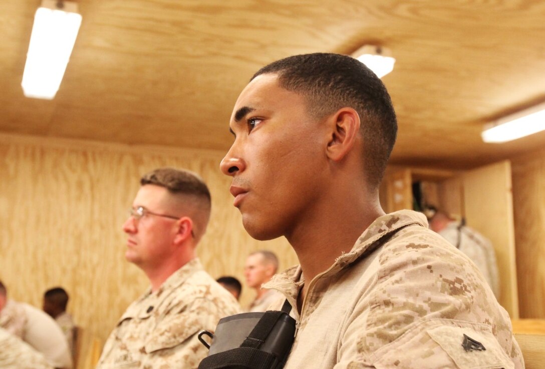 Corporal Anthony Ortiz, a combat electrician with Redeployment and Retrograde in support of Reset and Reconstitution Operations Group, Regional Command (Southwest), focuses on learning objectives during an Operational Stress Control and Readiness class aboard Camp Leatherneck, Afghanistan, May 29, 2014. During the OSCAR class, Marines discussed the signs of high-level stress and proper paths to treat the symptoms and get the individual back on track.