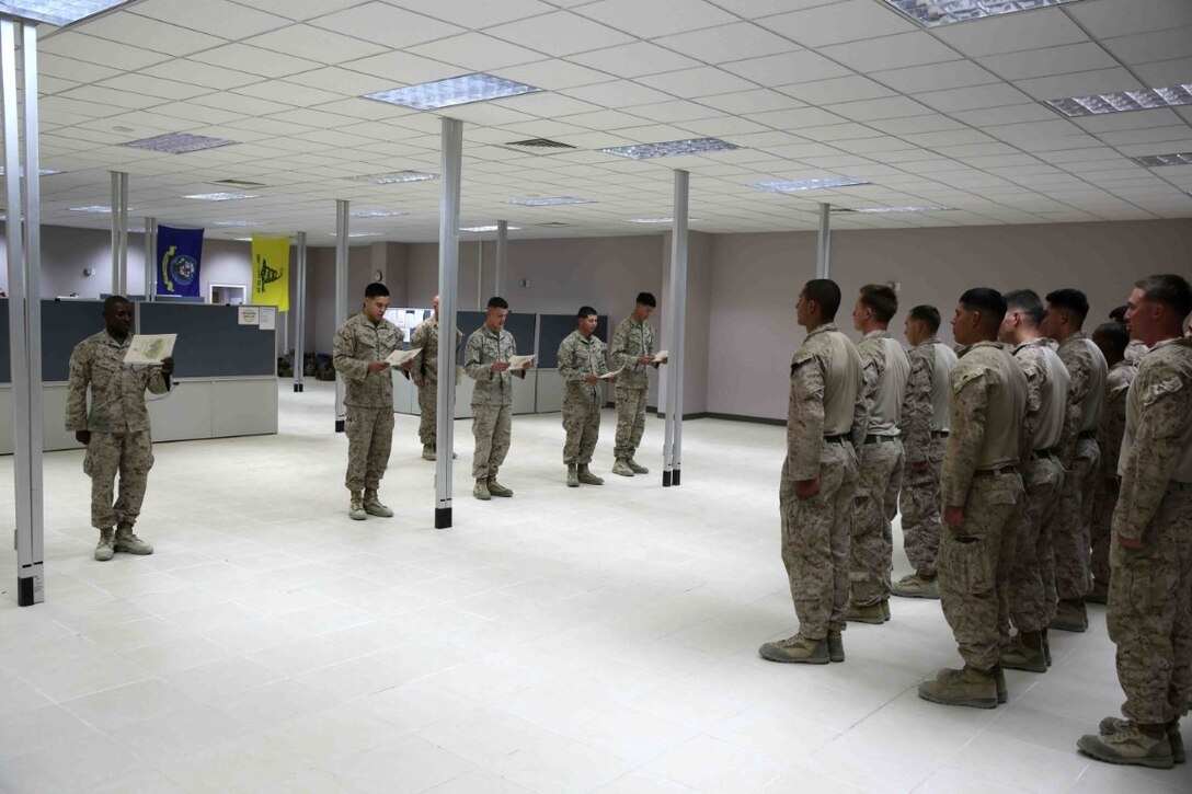 Marines with Headquarters and Service Company, 1st Battalion, 7th Marine Regiment, read aloud the Noncommissioned Officer Creed during a promotion ceremony aboard Camp Leatherneck, Afghanistan, June 1, 2014. Twenty-eight Marines with the battalion were promoted to the ranks of corporal and sergeant, June 1 and 2. (U.S. Marine Corps photo by Cpl. Joseph Scanlan / released)