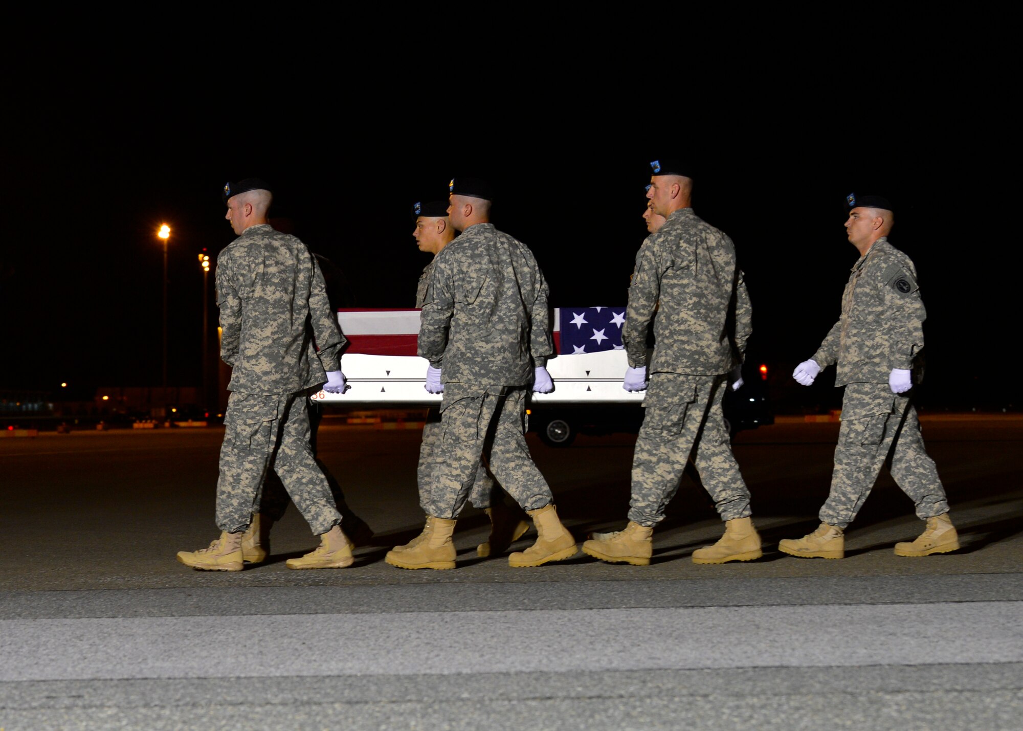 A U.S. Army carry team transfers the remains of Spc. Matthew H. Walker of Hillsboro, Mo., during a dignified transfer June 7, 2014, at Dover Air Force Base, Del., Walker was assigned to 1st Battalion, 502nd Infantry Regiment, 2nd Brigade Combat Team, 101st Airborne Division, Fort Campbell, Ky. (U.S. Air Force photo/Airman 1st Class William Johnson)